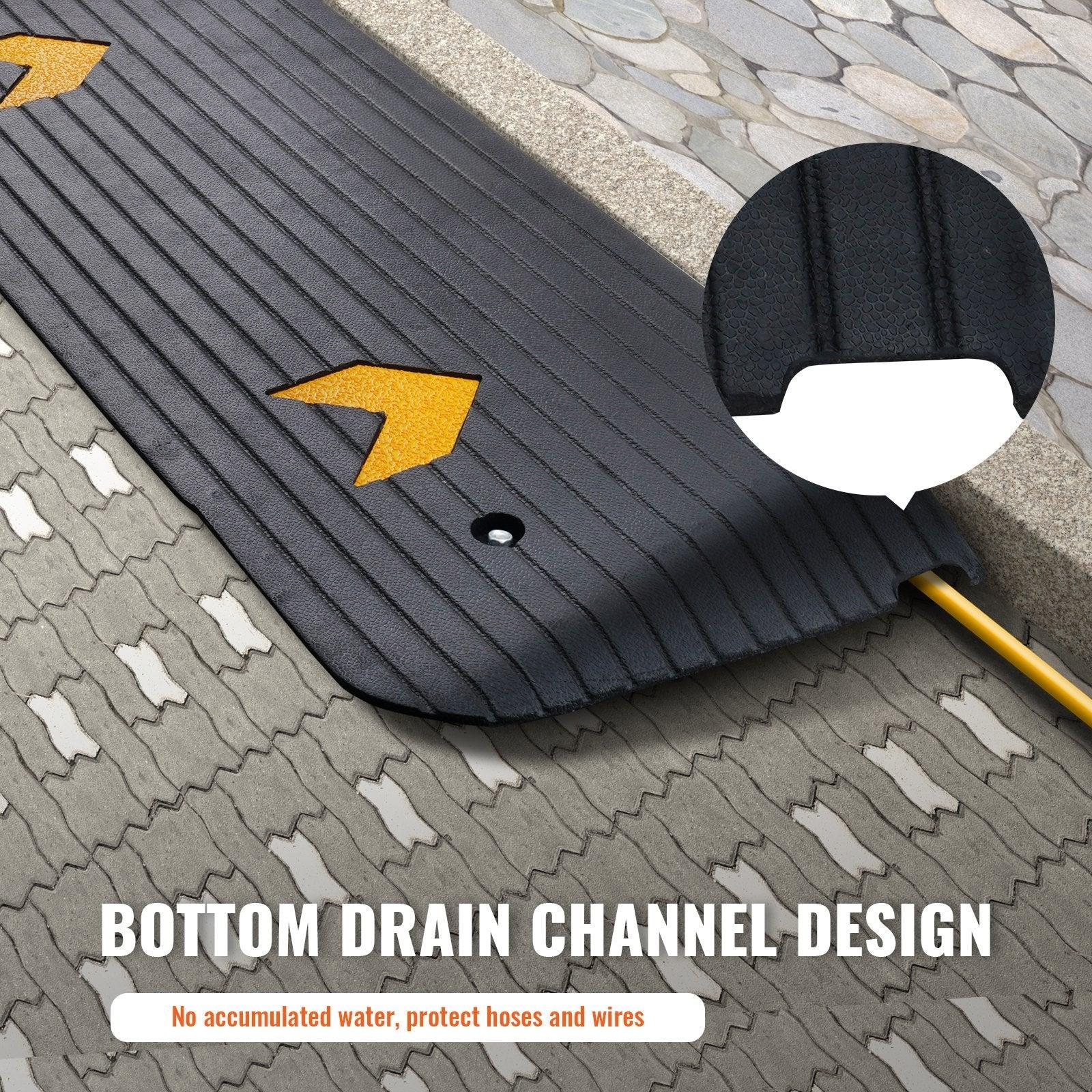 Coocosh Protective Mat with Bottom Drain Channel Design, made from durable material, black color, featuring yellow arrows, ideal for preventing water accumulation and safeguarding hoses and wires, viewed from an overhead angle.
