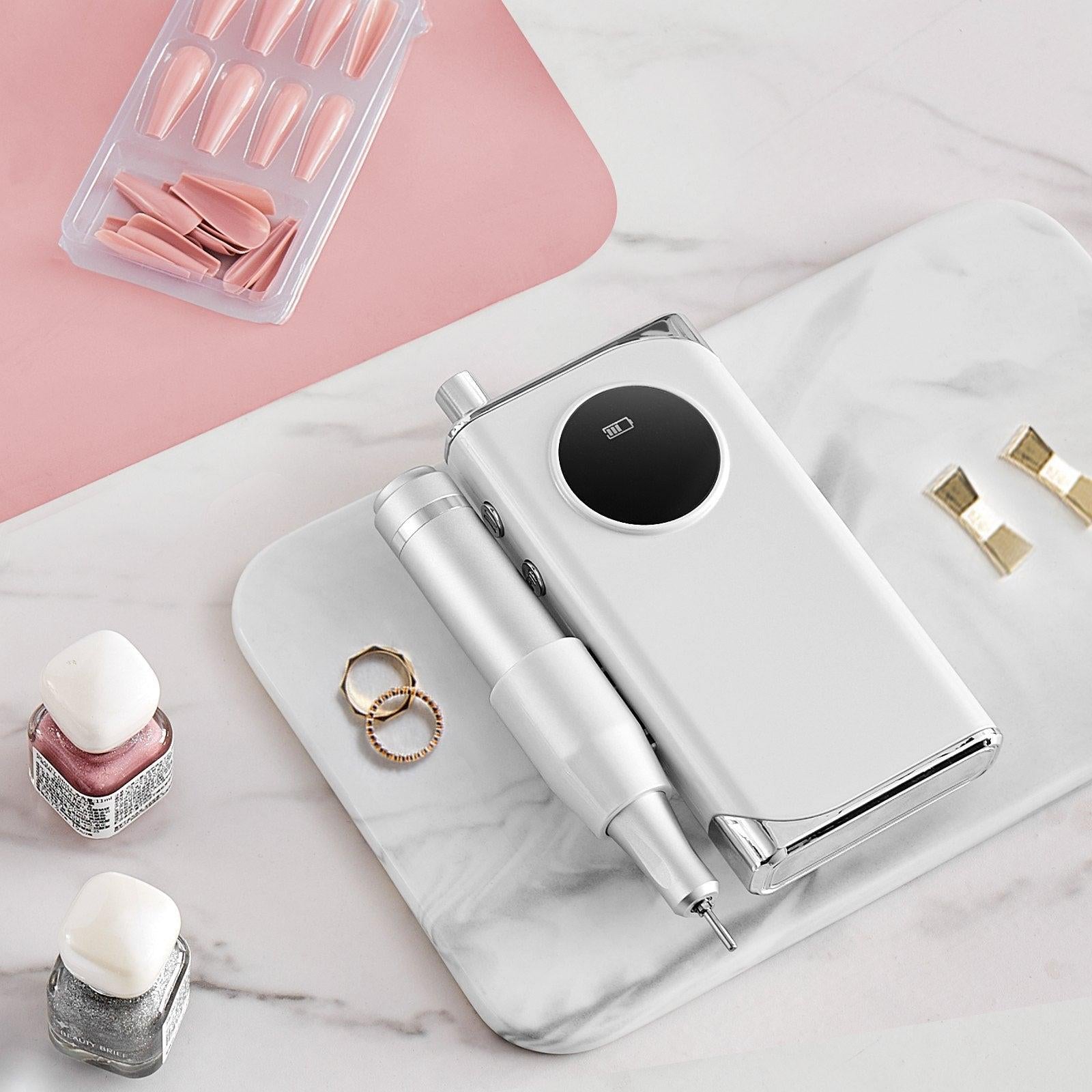 Coocosh Nail Drill offers 40,000RPM speed, cordless convenience for manicures, and an elegant white design, perfect for professional salon environments.