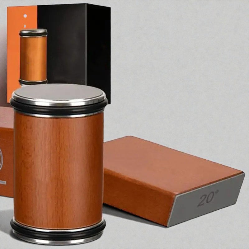 Coocosh wooden cylinder case with silver lid and black accents, on a light grey background, showing its elegant design and premium materials.