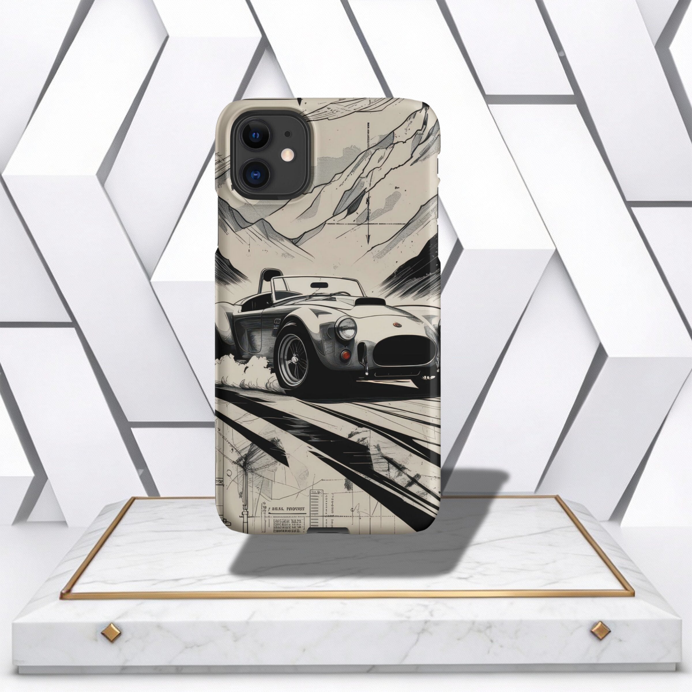 Coocosh Phone Case featuring a vintage race car design with mountain backdrop, offering durable protection and stylish aesthetics in a neutral color, displayed on a pedestal. This case offers a unique perspective on classic design.