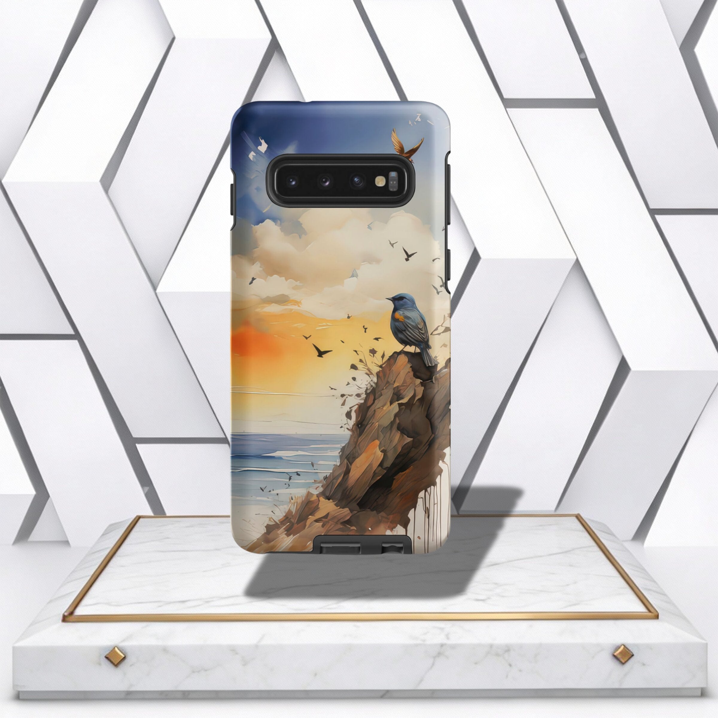 Coocosh phone case featuring a bird on a cliffside overlooking the ocean at sunset, providing a unique and artistic look with a blue, orange, and brown color palette. The case offers protection from scratches and bumps. The phone case is showcased on a pe