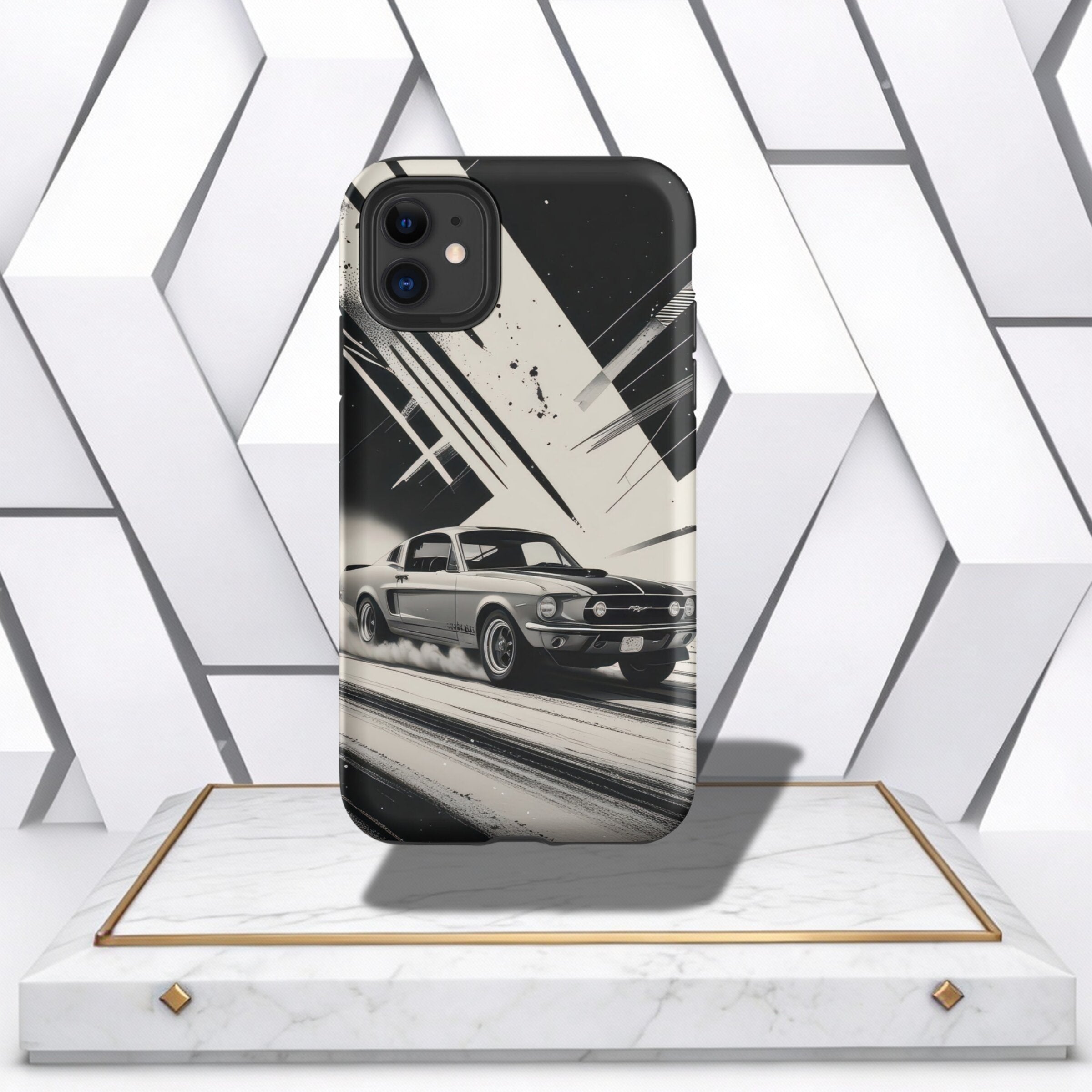 Coocosh Phone Case featuring a classic Mustang car in a dynamic, monochromatic design. Made with durable plastic, the case offers protection with a vintage aesthetic. Standard size, displaying the car in action from a low angle. Period.