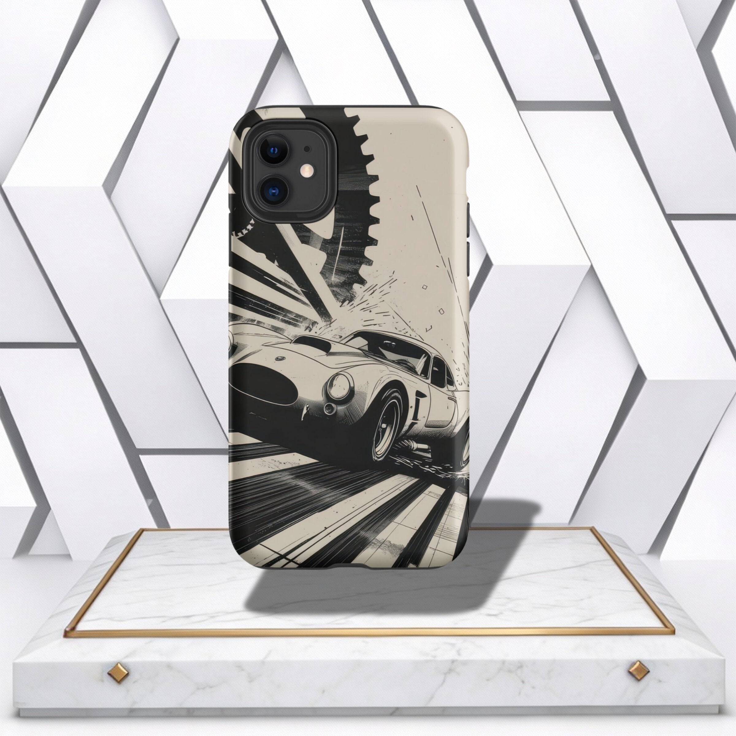 Coocosh phone case featuring a classic race car and gear design in monochrome, showcasing a durable protective shell. A stylish accessory with a vintage aesthetic, suitable for everyday use. The perspective is from a product display on a marble and gold p