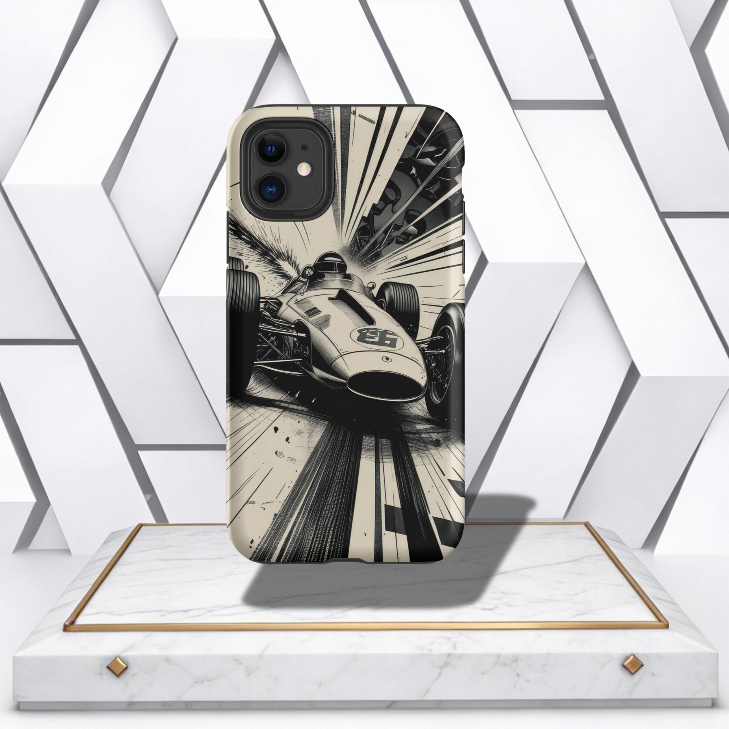 Coocosh Phone Case showcasing a vintage race car speeding along a track with dynamic motion lines, in black and white, displayed on a modern white marble pedestal, adding a touch of retro style. Perfect for racing enthusiasts. Period.