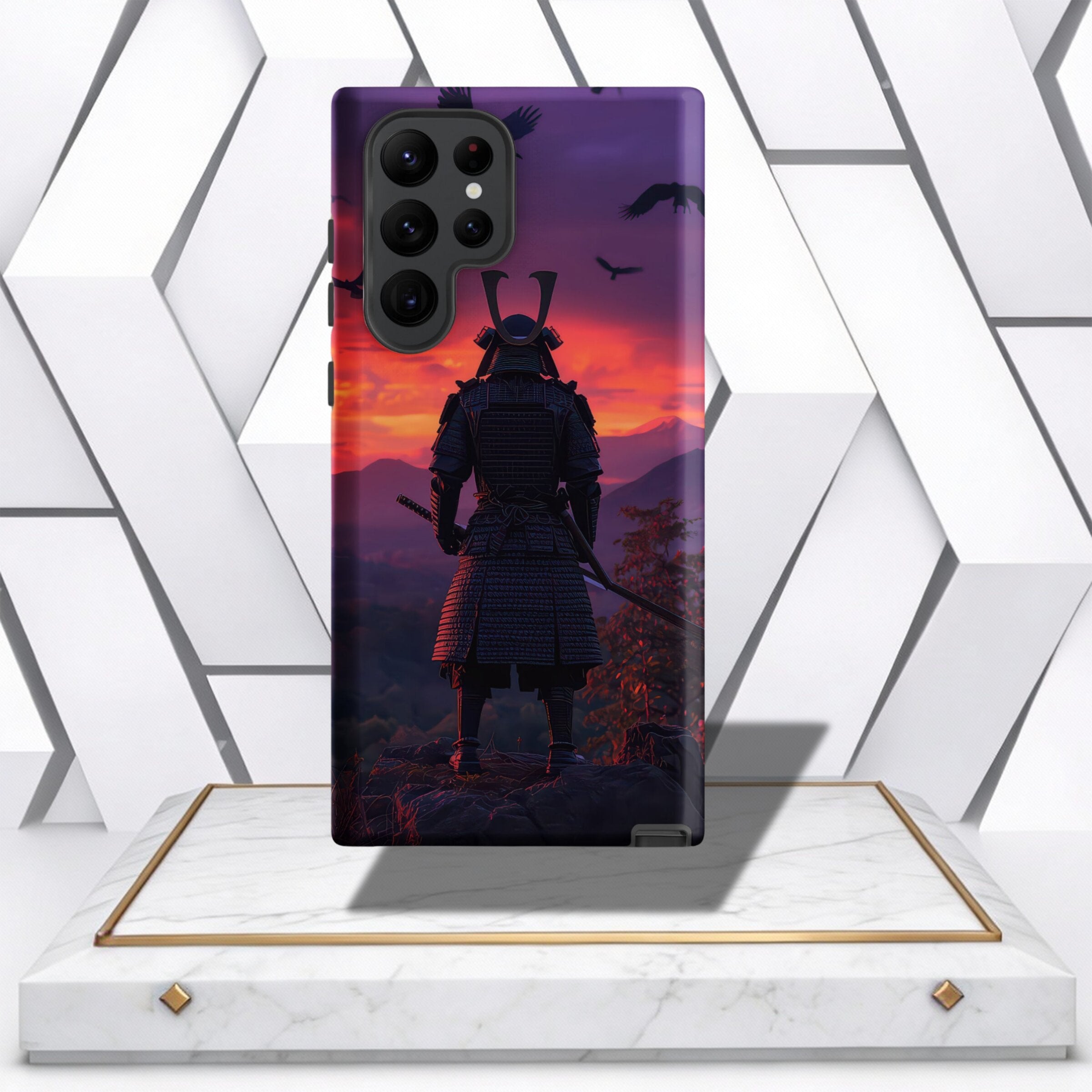 Coocosh Phone Case featuring a Samurai Warrior design, showcasing a majestic figure overlooking a mountainous landscape at sunset with crows in flight. The case offers protection while adding a unique style element to your phone. The purple and red hues c