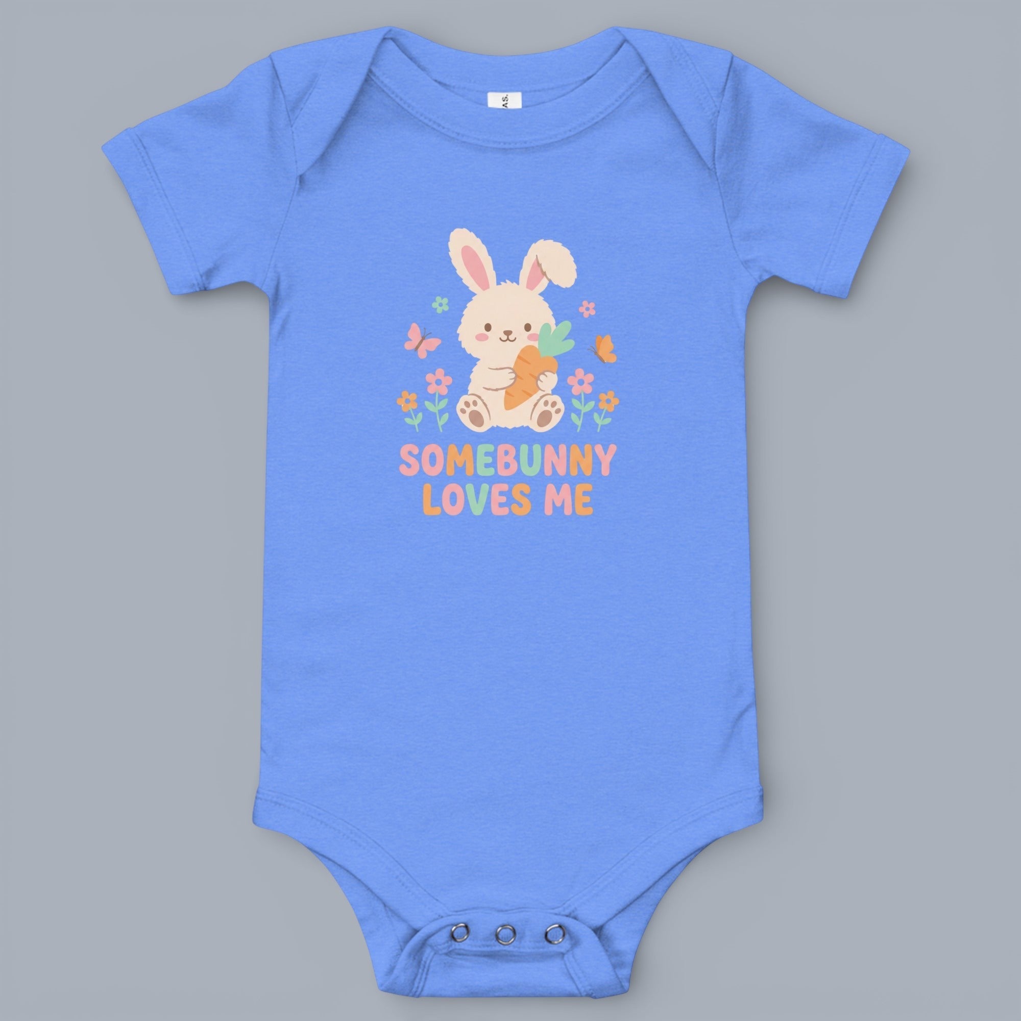 Coocosh Baby Onesie features a cute bunny graphic with a carrot and the text "Somebunny Loves Me" made of cotton, in light blue color, ideal for a baby shower gift or Easter photos. It's adorable.