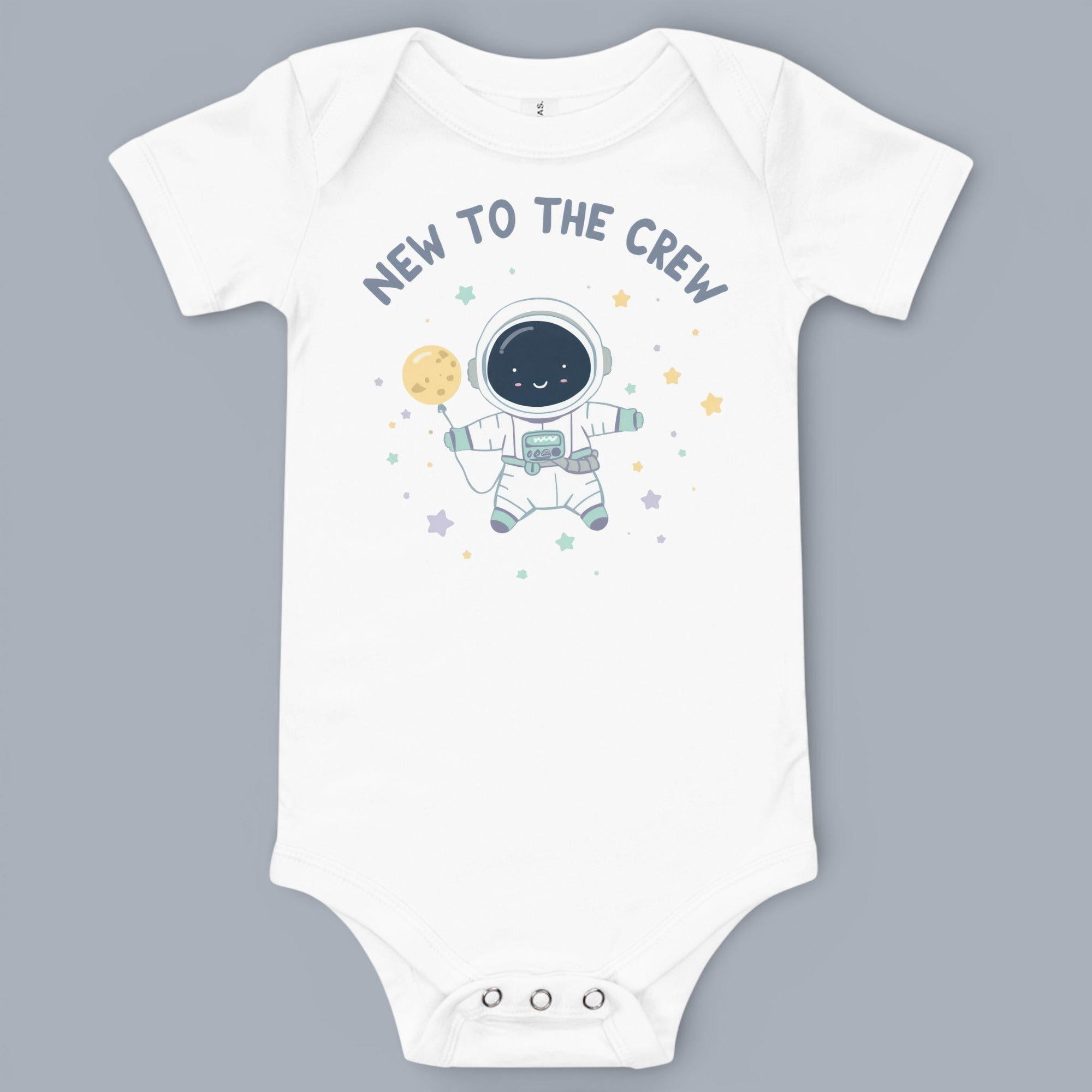 Coocosh Baby Onesie featuring a cute astronaut graphic. This soft, white onesie is perfect for the newest crew member, adding a touch of cosmic charm to baby's wardrobe. Adorable.