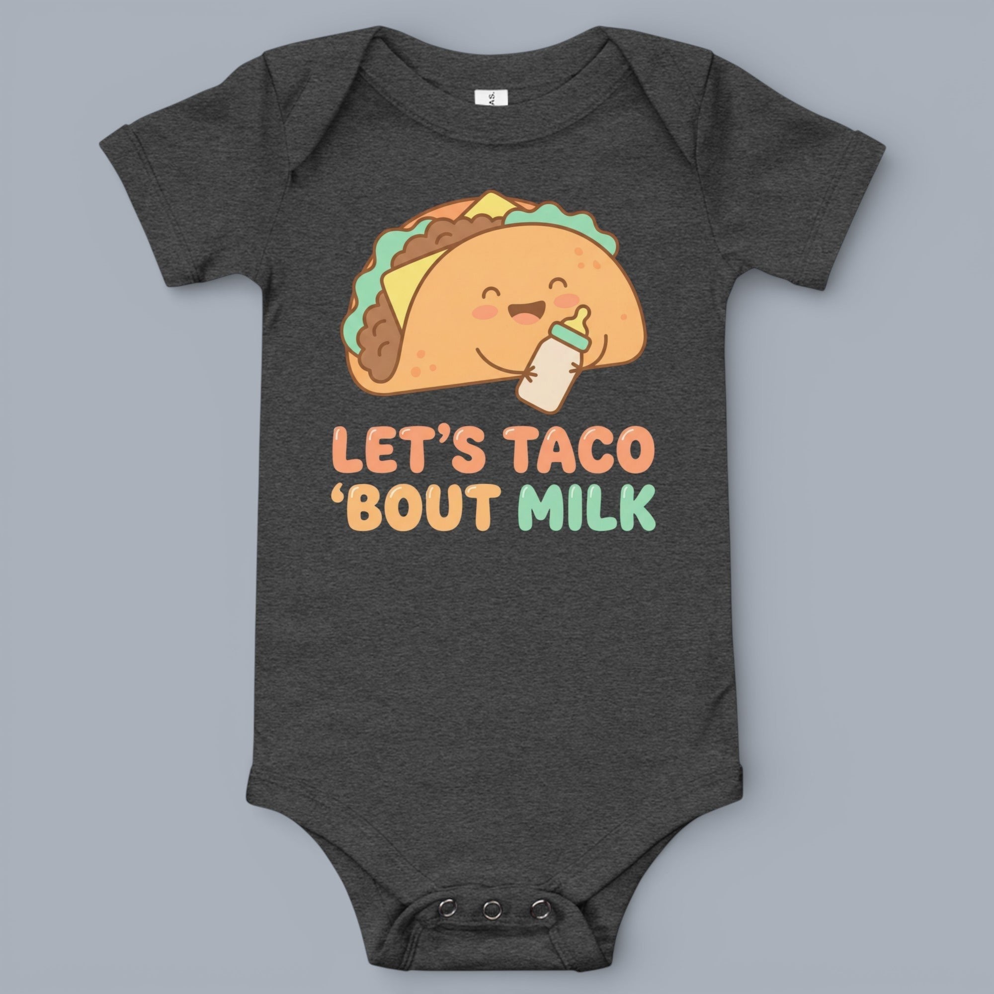 Coocosh baby onesie featuring a cartoon taco holding a baby bottle with the text "Let's Taco 'Bout Milk", made of soft, heather gray fabric. Ideal for playful parents and their little ones, capturing a humorous and sweet moment. Perfect for everyday wear 