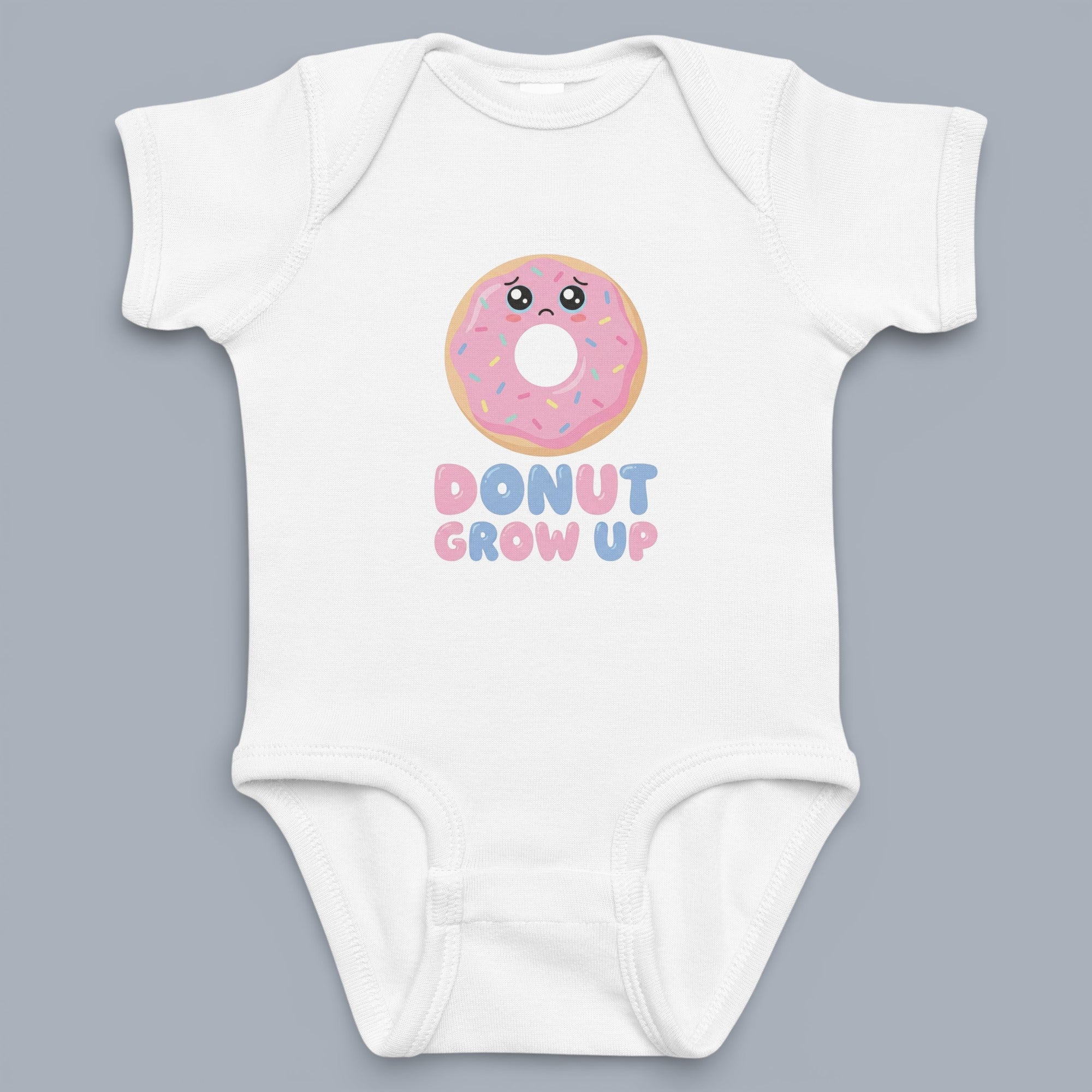 Coocosh baby onesie with a funny donut design that says "Donut Grow Up". This short-sleeved bodysuit is made of soft, breathable fabric and features a cute, playful print. White. Period.