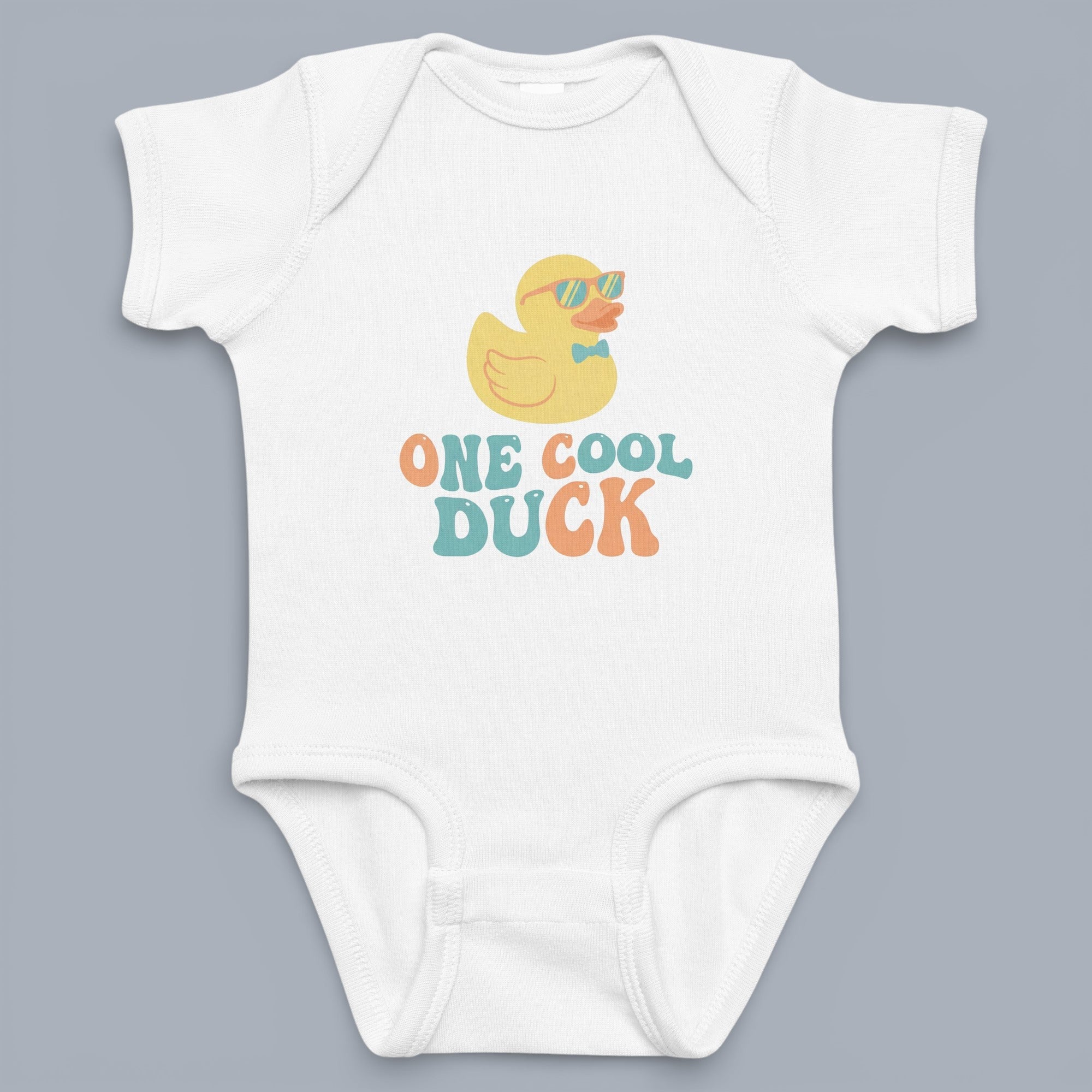 Coocosh Baby Onesie featuring a charming rubber ducky design with sunglasses and a bow tie, set against a soft white backdrop. Perfect for your cool little duck. This delightful onesie promises both comfort and style for your baby's everyday adventures. I