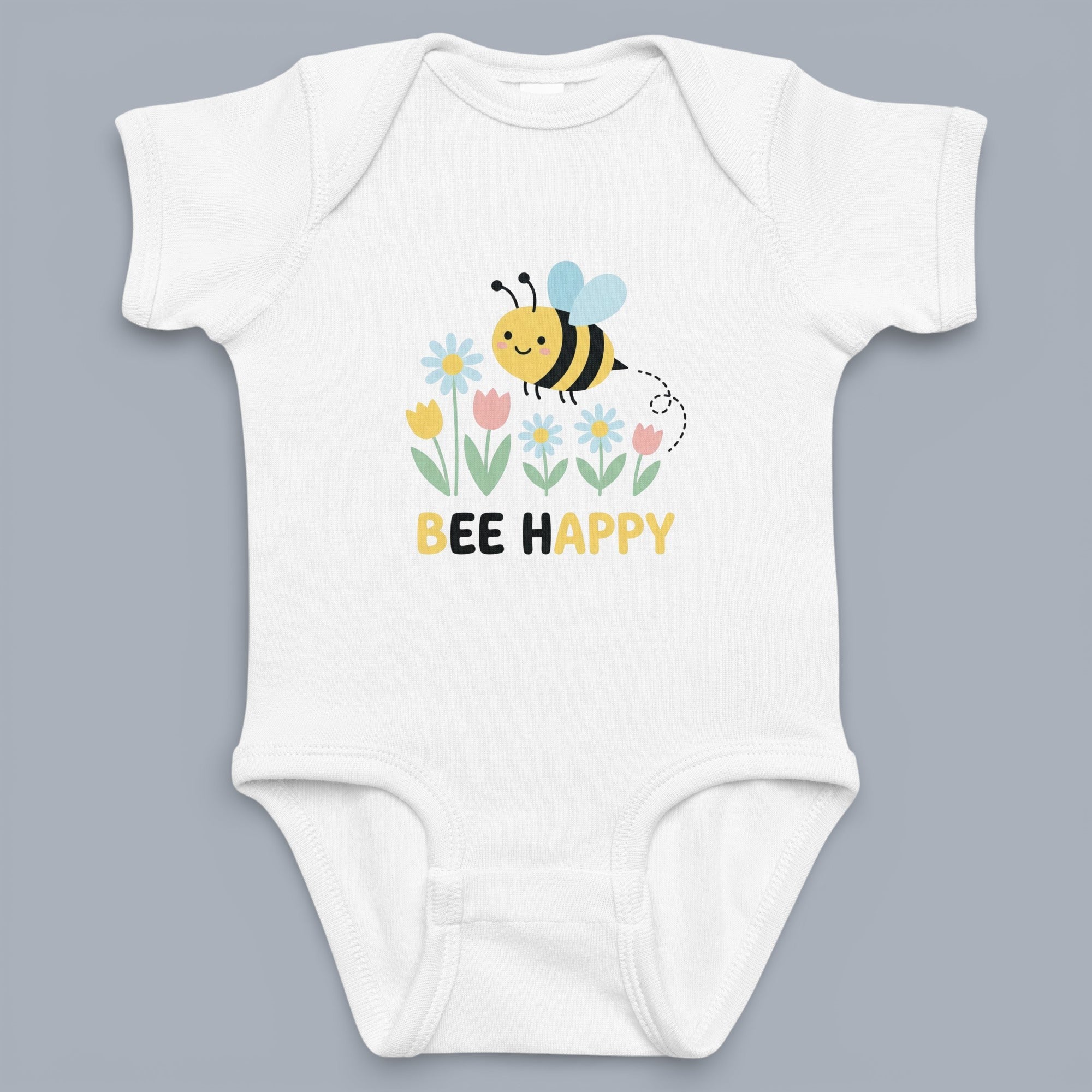 Coocosh baby bodysuit with a cute bee and floral design. The graphic features "Bee Happy" text, making it a charming and cheerful addition to any baby's wardrobe. White color. Period.
