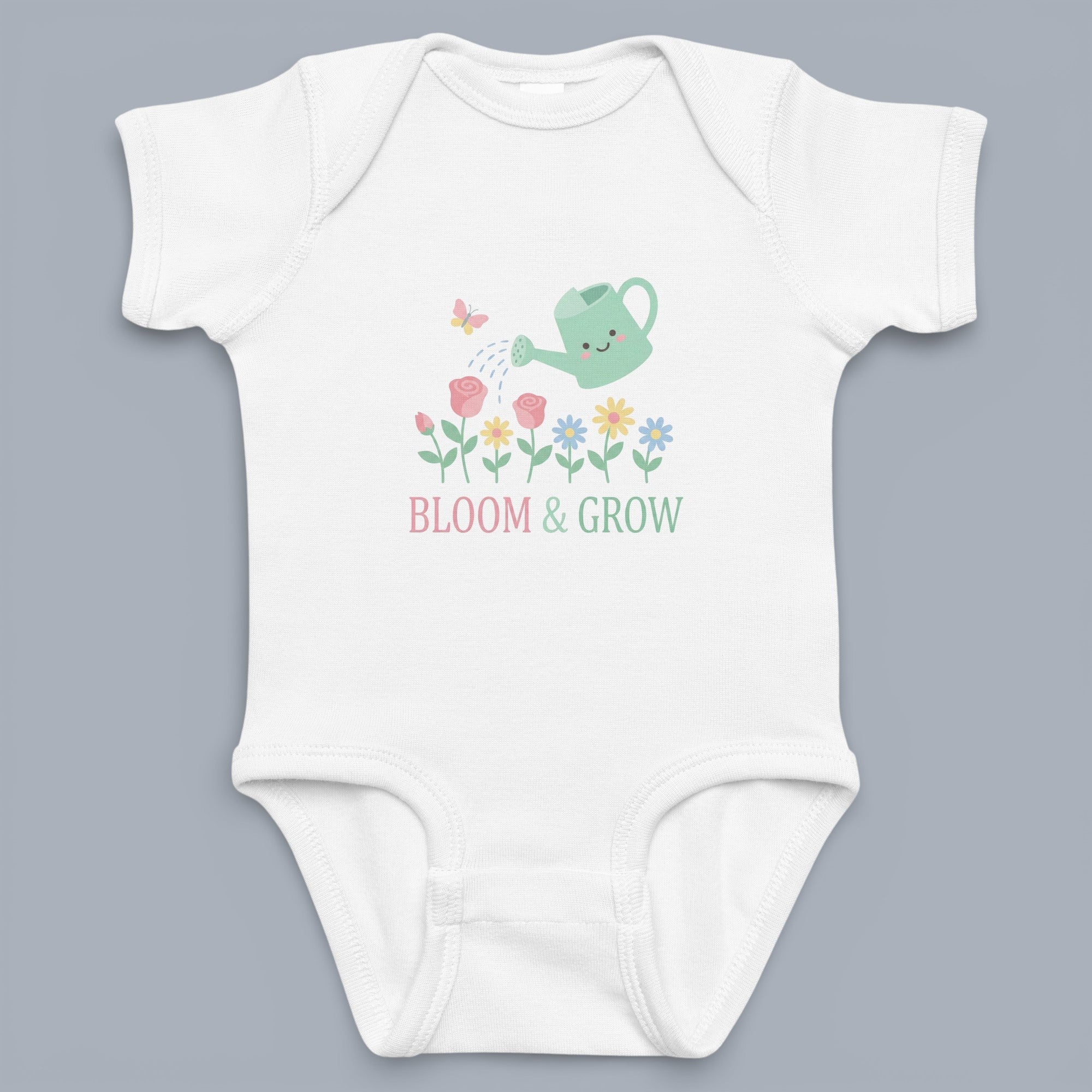 Coocosh Baby Onesie featuring a whimsical 'Bloom & Grow' design with a smiling watering can, delicate flowers, and a butterfly, printed on soft white fabric. Perfect for playtime or naps.