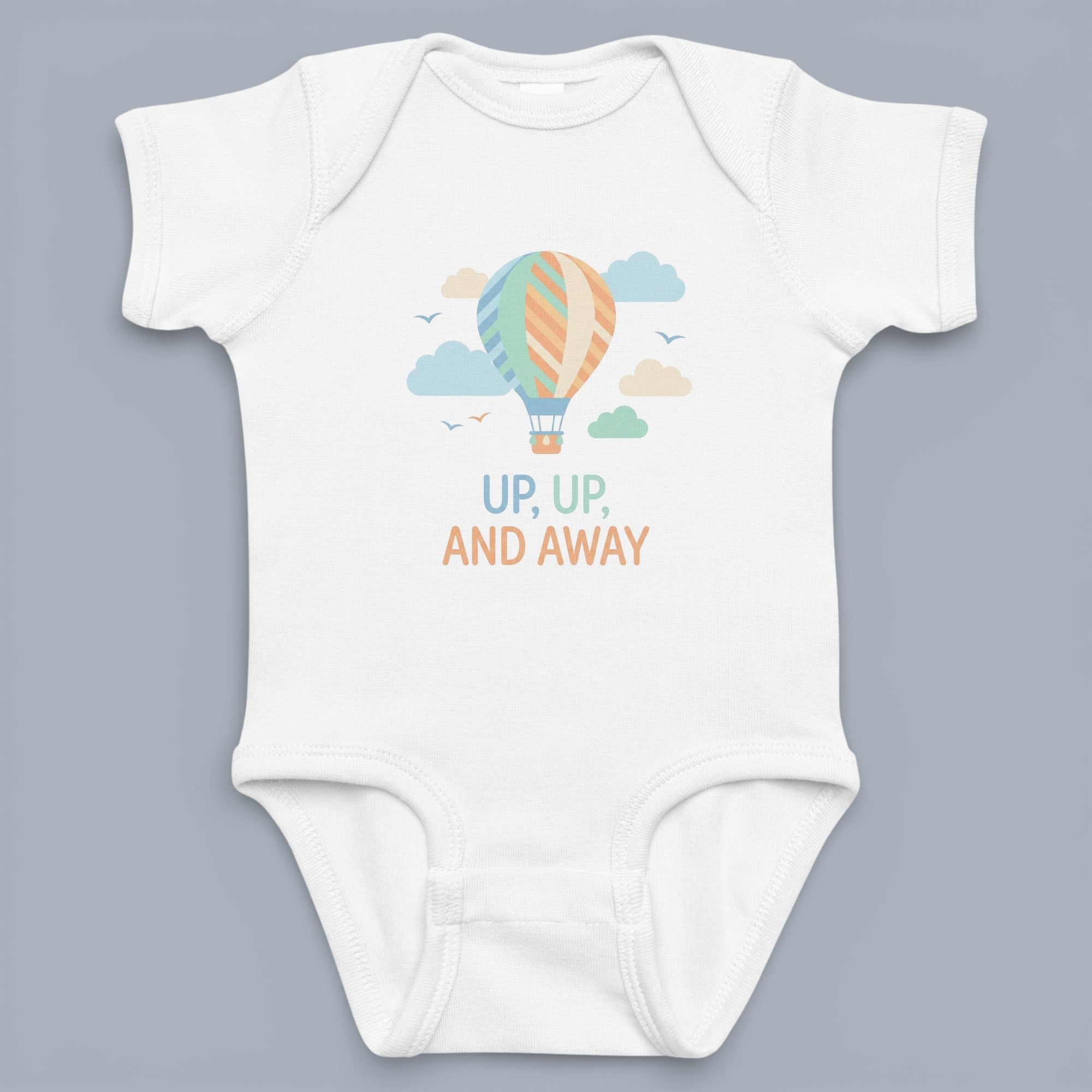 Coocosh Baby Onesie featuring a whimsical hot air balloon design with pastel clouds and the phrase "Up, Up, and Away" printed on soft, white fabric, creating a charming and comfortable outfit for infants. Perfect for everyday wear and special occasions.