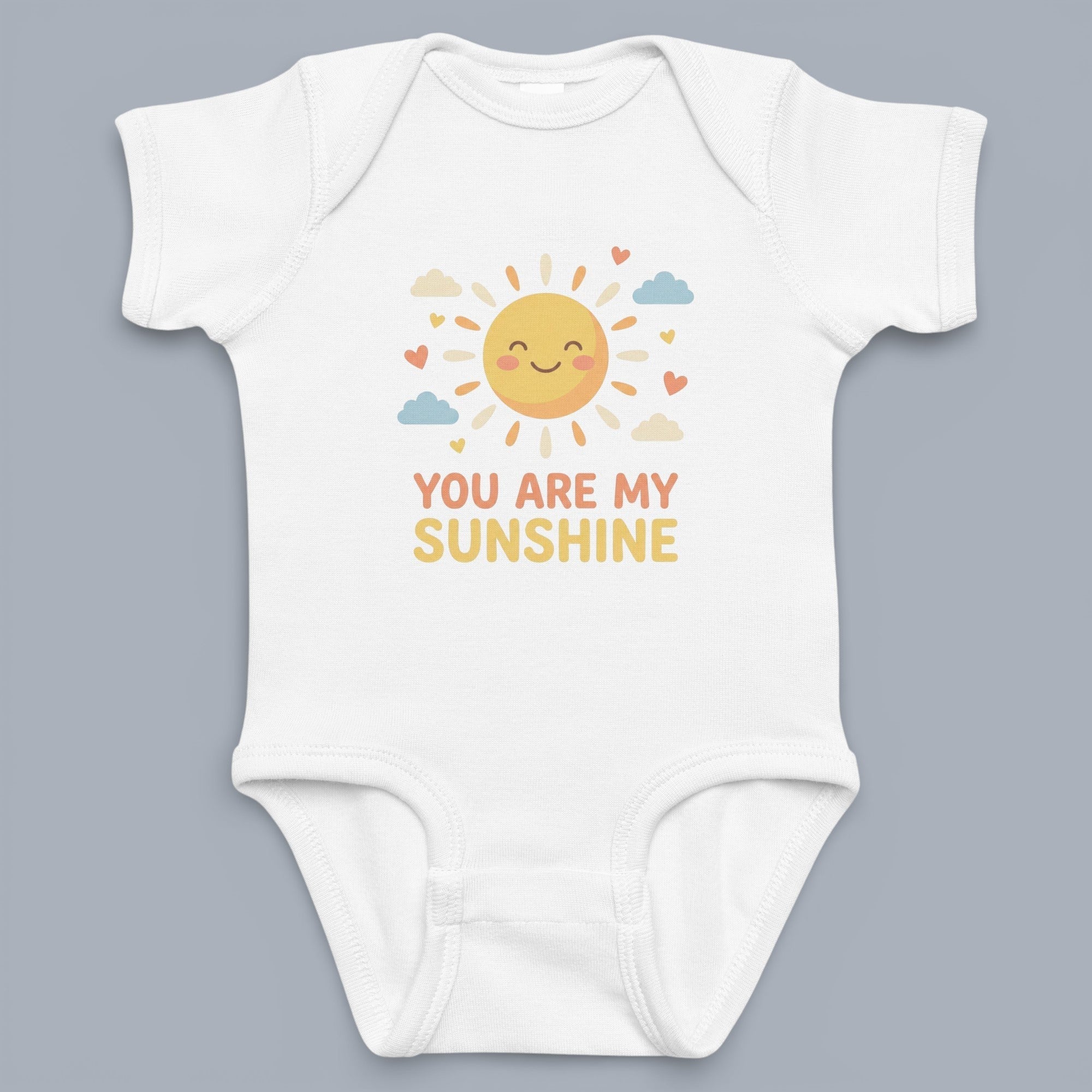 Coocosh Baby Onesie featuring a cute cartoon sun graphic with hearts and clouds, and the phrase "You Are My Sunshine", perfect for everyday wear in soft, breathable white cotton..