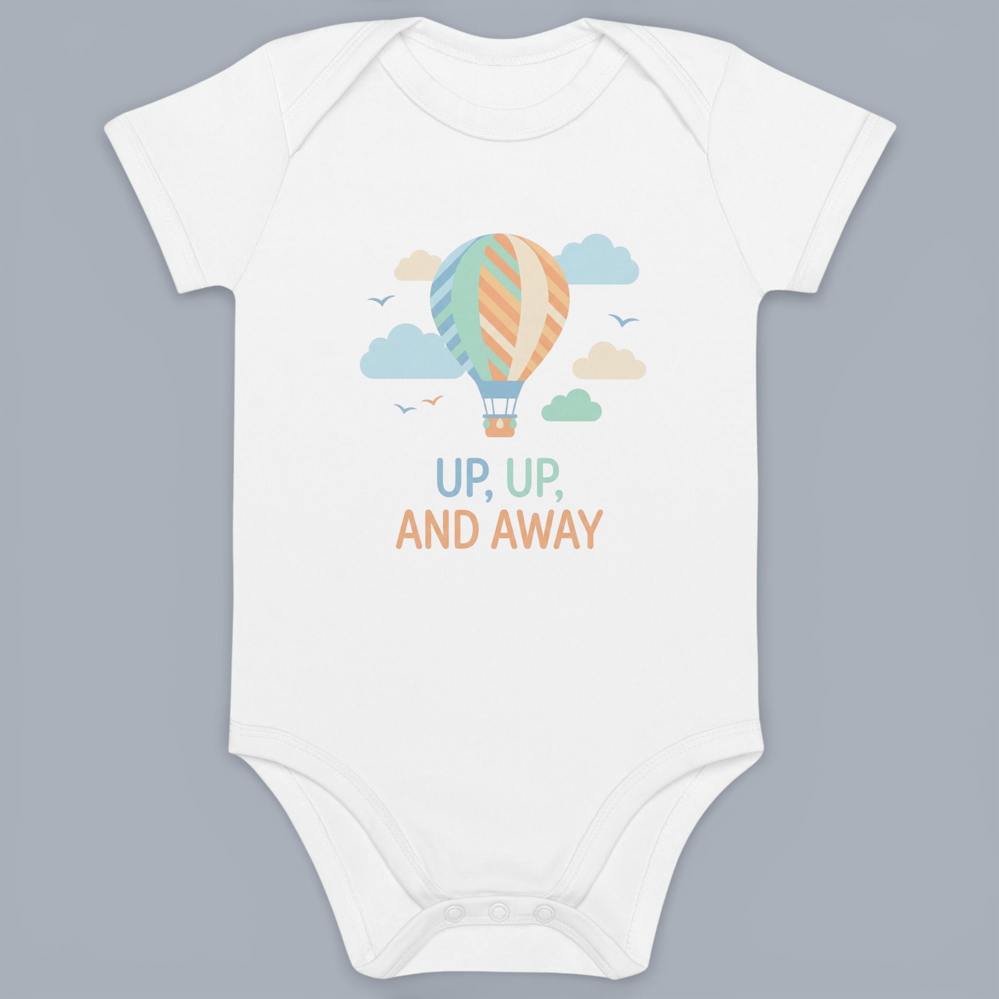 Coocosh Baby Onesie features a whimsical hot air balloon design with pastel colors and the phrase "Up, Up, and Away," adding a touch of adventure to your baby's wardrobe. Made of soft cotton, the onesie ensures comfort and ease. This adorable piece is per