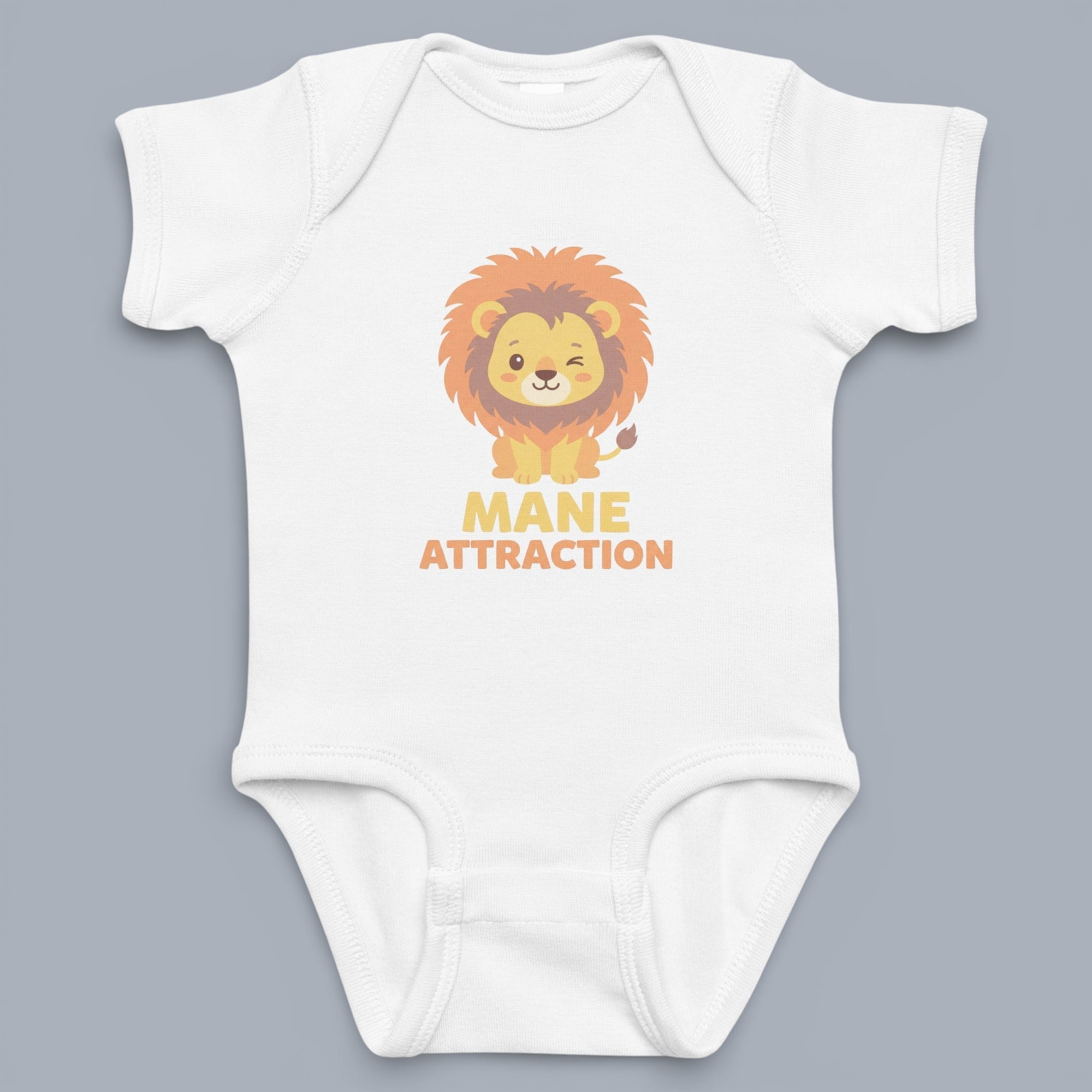 Coocosh Baby Bodysuit with a cute lion cub graphic design and the text 'Mane Attraction'. Made of soft, white fabric, this baby onesie is perfect for your little one. The image is a close-up studio shot. Endowing it with a warm feel.