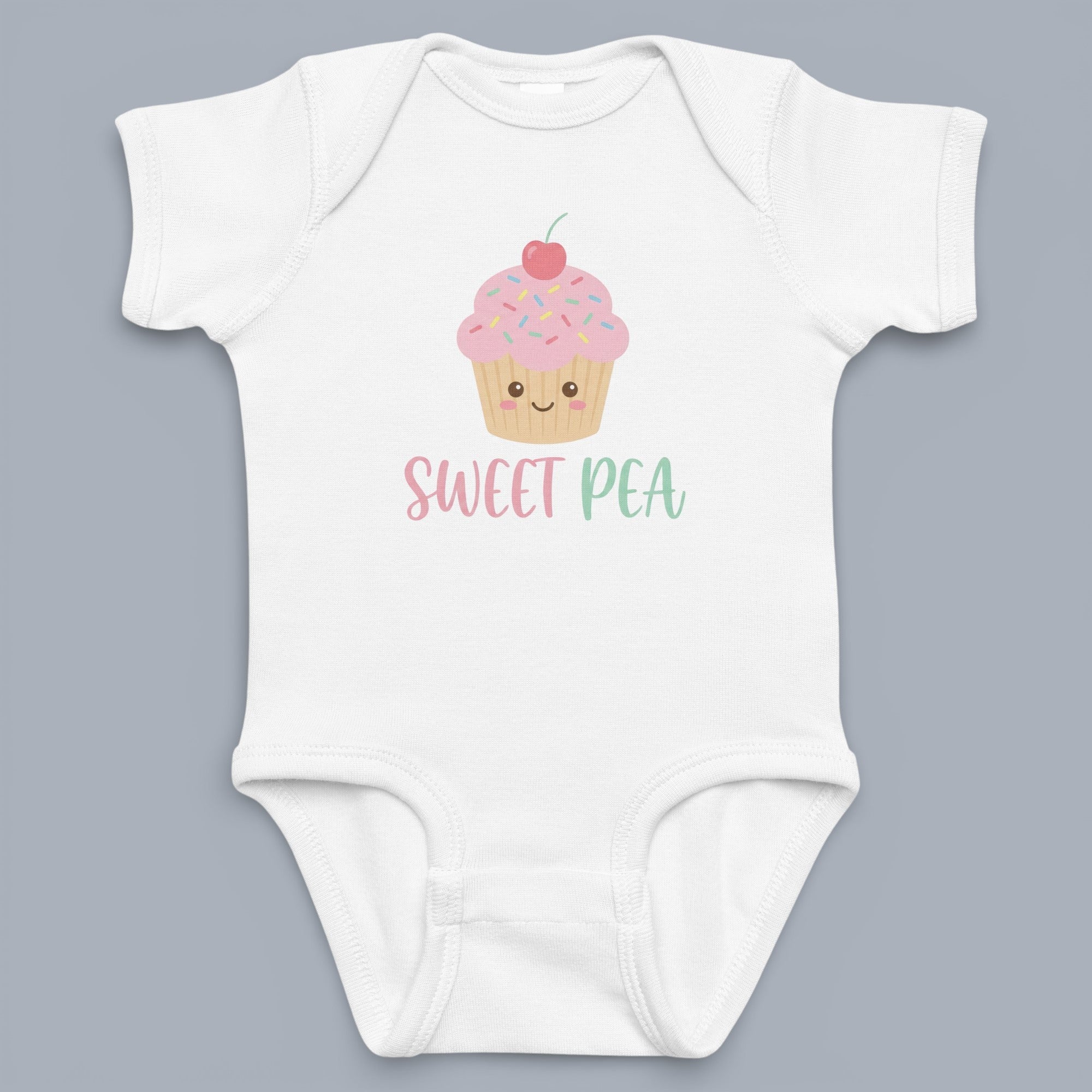 Coocosh Baby Bodysuit featuring a cute cupcake design and the phrase "Sweet Pea," made from soft, breathable fabric in white, perfect for everyday wear. Fun and comfy.