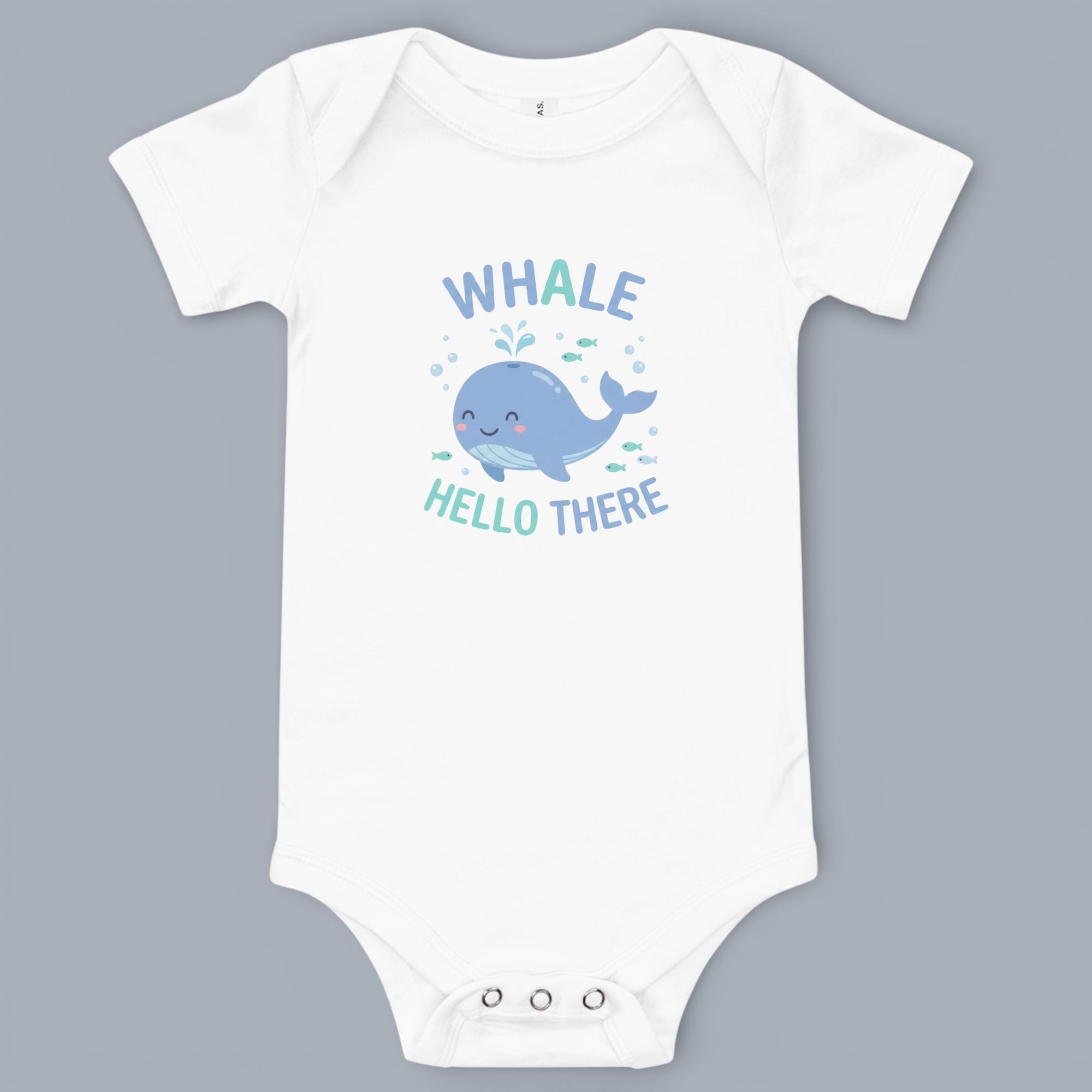 Coocosh Baby Onesie featuring a cute whale graphic and the text "Hello There", made of soft white cotton. A charming and comfortable outfit for infants. Perfect for playtime or bedtime.
