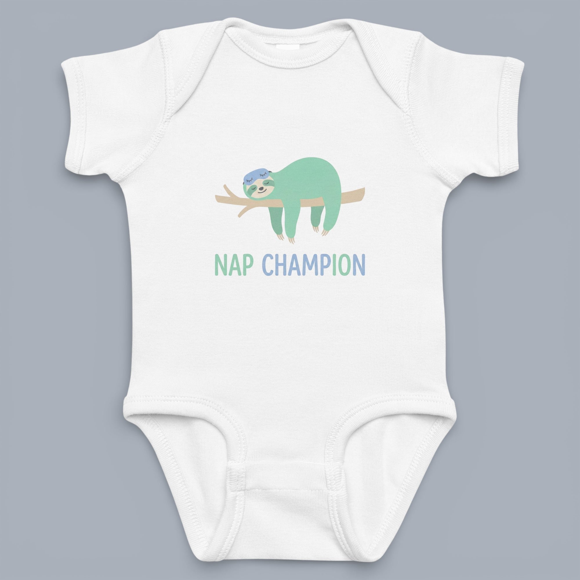 Coocosh Baby Onesie features a sleeping sloth on a branch with 'Nap Champion' text. Made of soft, breathable fabric, white color, standard fit. Great for everyday wear and naps. Period.