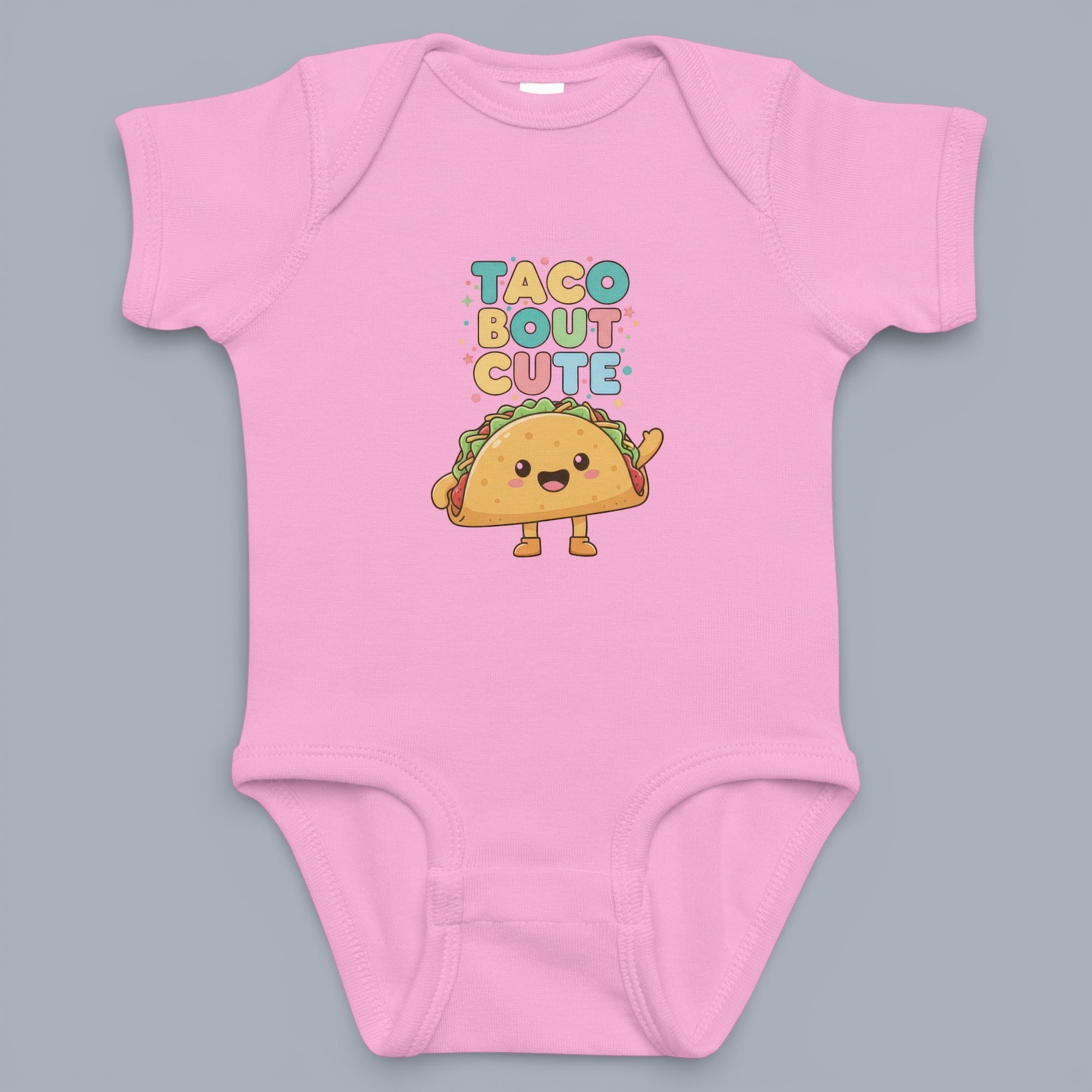 Coocosh Baby Onesie features a cute taco graphic with "Taco Bout Cute" text, made from soft, breathable fabric, light pink color, standard fit, ideal for everyday wear. Period.