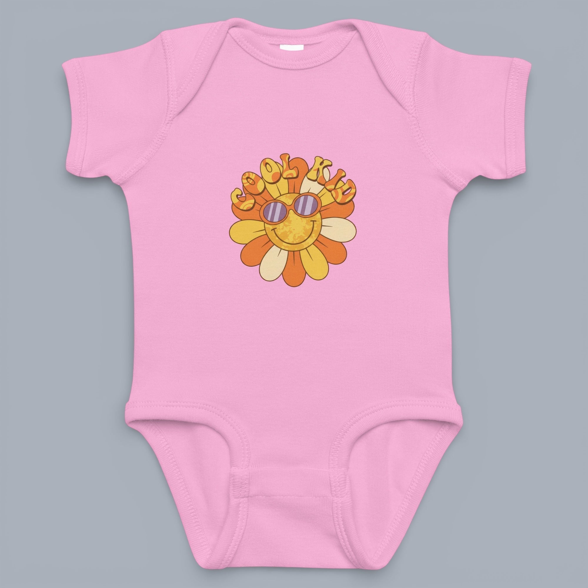 Coocosh baby bodysuit features a cute sun with sunglasses design in retro colors on a soft, pink cotton. A comfy and stylish addition to your baby's wardrobe. Perfect for everyday wear.