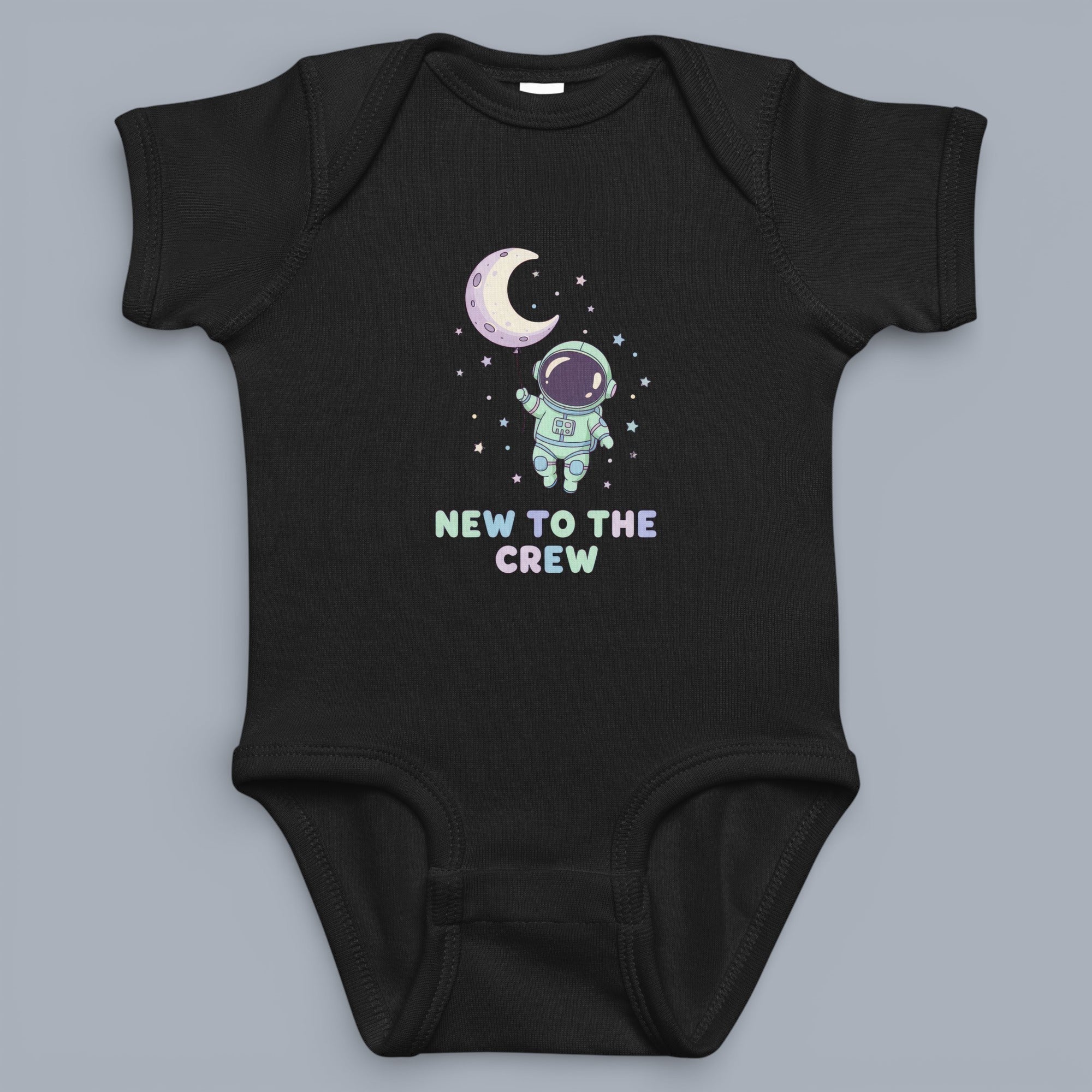 Coocosh baby bodysuit featuring a cute astronaut and moon design, perfect for newborns to toddlers. Made with soft black cotton, ensuring a comfortable fit for your little crew member. The design includes stars and the words 'New to the Crew'.