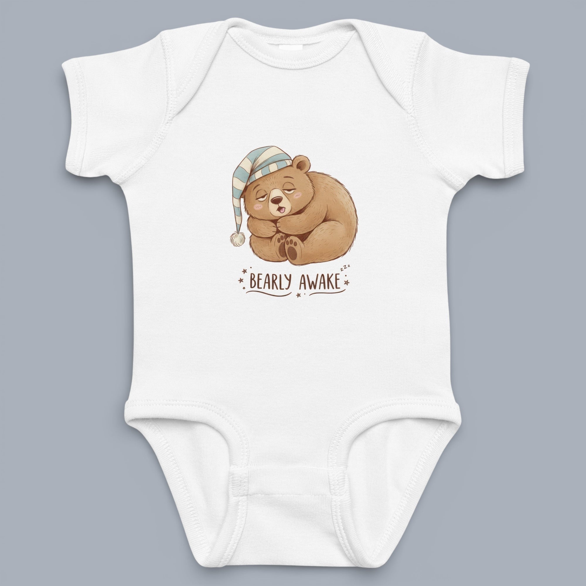 Coocosh baby onesie featuring a sleeping bear with a striped hat design. The onesie is white and appears to be made of soft cotton fabric for ultimate comfort. Perfect for playtime or nap time.