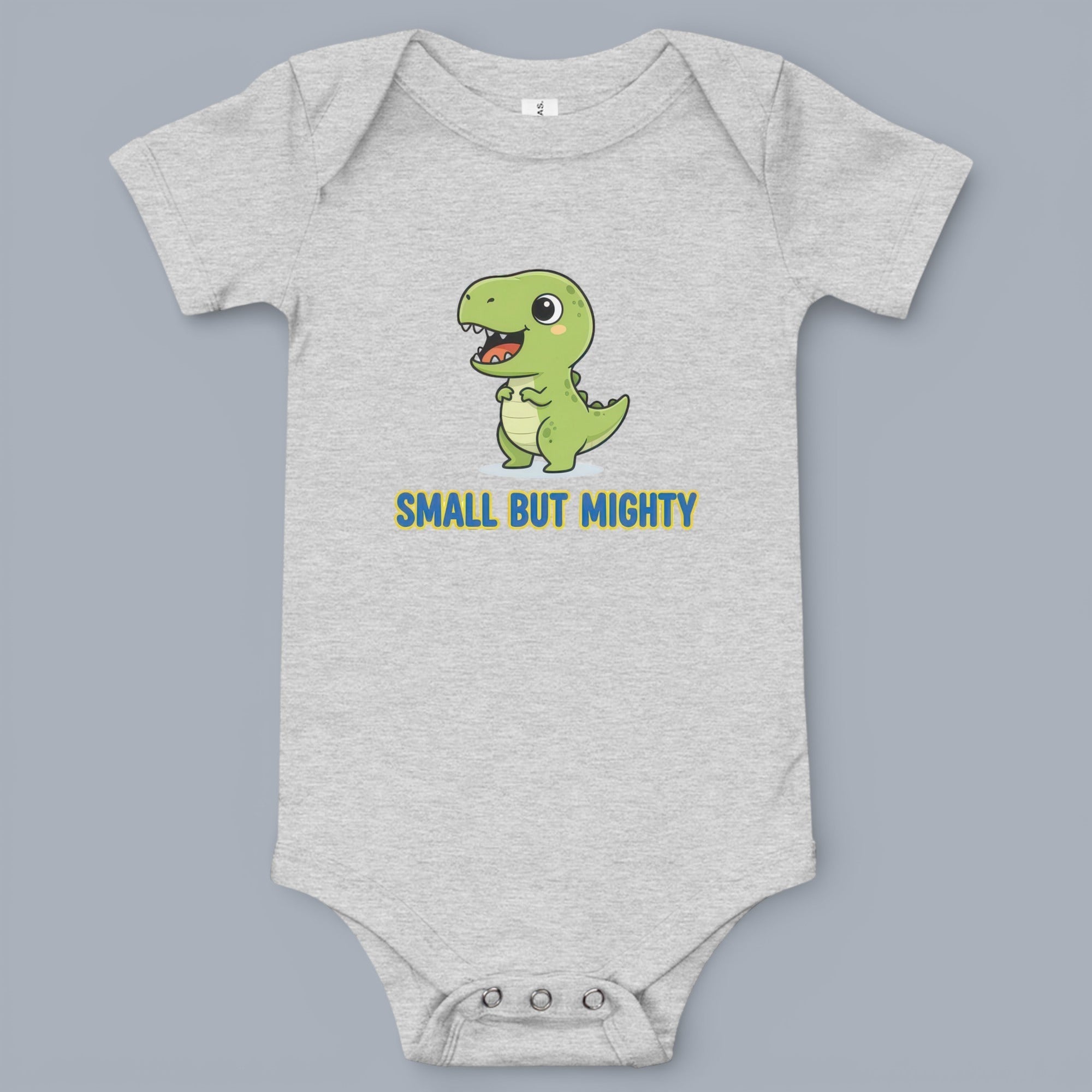 Coocosh Baby Onesie features a fun cartoon dinosaur graphic with "Small But Mighty" text, made of soft, breathable cotton in heather grey. Perfect for everyday wear for baby.
