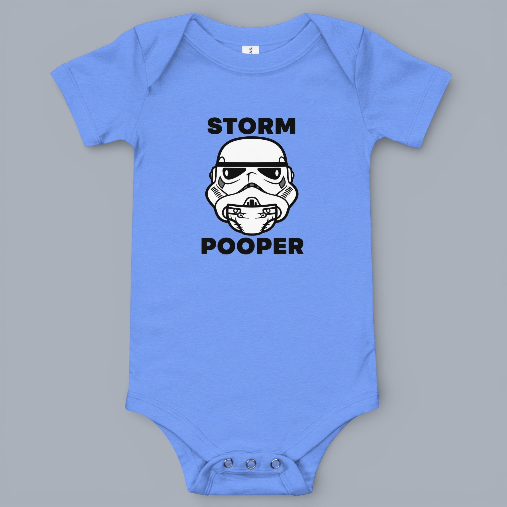 Coocosh Baby Bodysuit featuring a Stormtrooper helmet graphic with the text 'Storm Pooper', made of soft cotton, in a light blue color, for babies up to 12 months. Close-up.