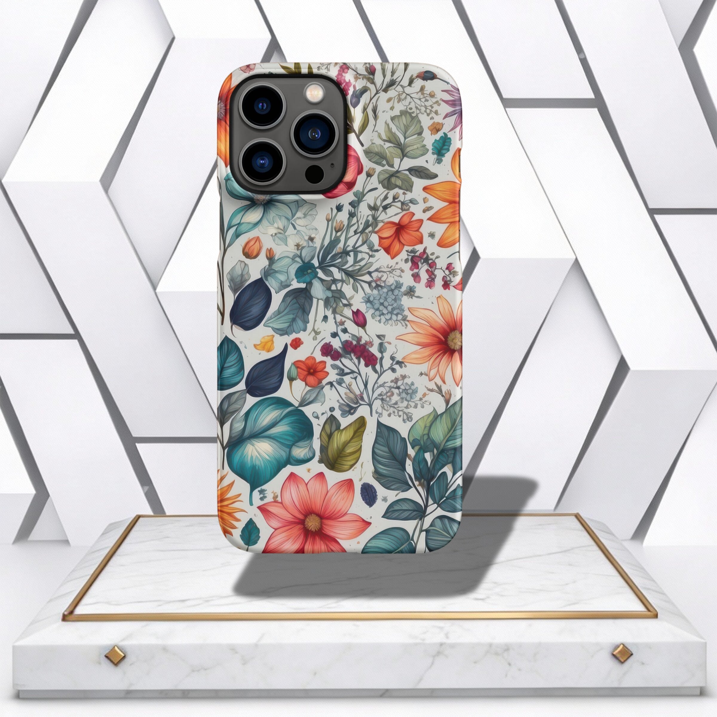 Coocosh Phone Case featuring a Vibrant Floral Pattern, combining watercolor-style flowers and leaves with a white background, showcased on a marble and gold pedestal. A stylish accessory to protect your phone with a touch of nature. The case is presented 