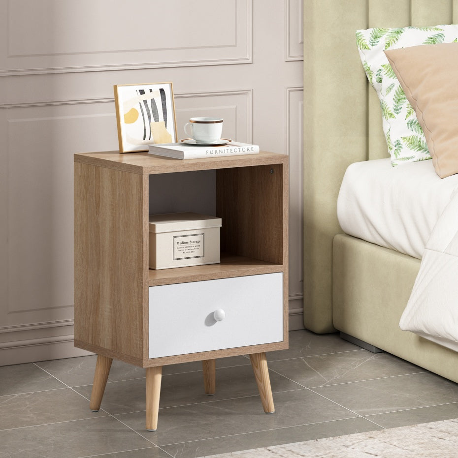 Coocosh Wooden Nightstand with Storage Drawer and Open Shelf, Light Brown and White, Compact Design, Perfect for Bedroom or Living Room, Measures Approximately 24 x 16 x 28 inches, Captured in a Lifestyle Setting.