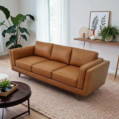 Coocosh Modern Sofa with Luxurious PU Leather Upholstery in Warm Tan, featuring a spacious three-seat design. Ideal for contemporary living spaces, measuring 78 inches in width. Showcasing a main view with natural light and stylish decor.