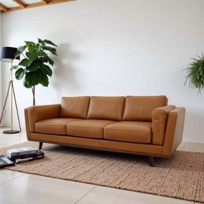 Coocosh mid-century modern sofa crafted from genuine leather, featuring a tan color and elegant wood legs, perfect for enhancing any stylish living space.