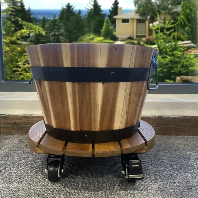 Coocosh Wooden Planter with Rolling Wheels, Natural Wood Grain and Black Metal Bands, 14 inches in height and 16 inches in diameter, showcased against a vibrant outdoor backdrop.