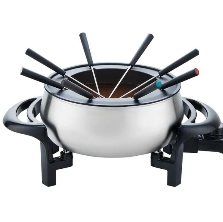 Stainless steel fondue pot with skewers on a white background