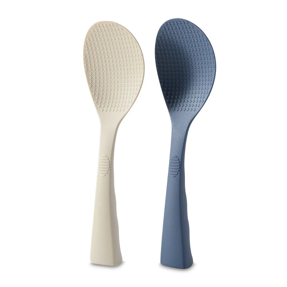 Coocosh elegant silicone rice spoons, one in soft beige and the other in sophisticated navy, feature a heat-resistant, non-stick design with textured surfaces for effortless serving and ergonomic grip, making meal prep seamless and stylish in any kitchen.