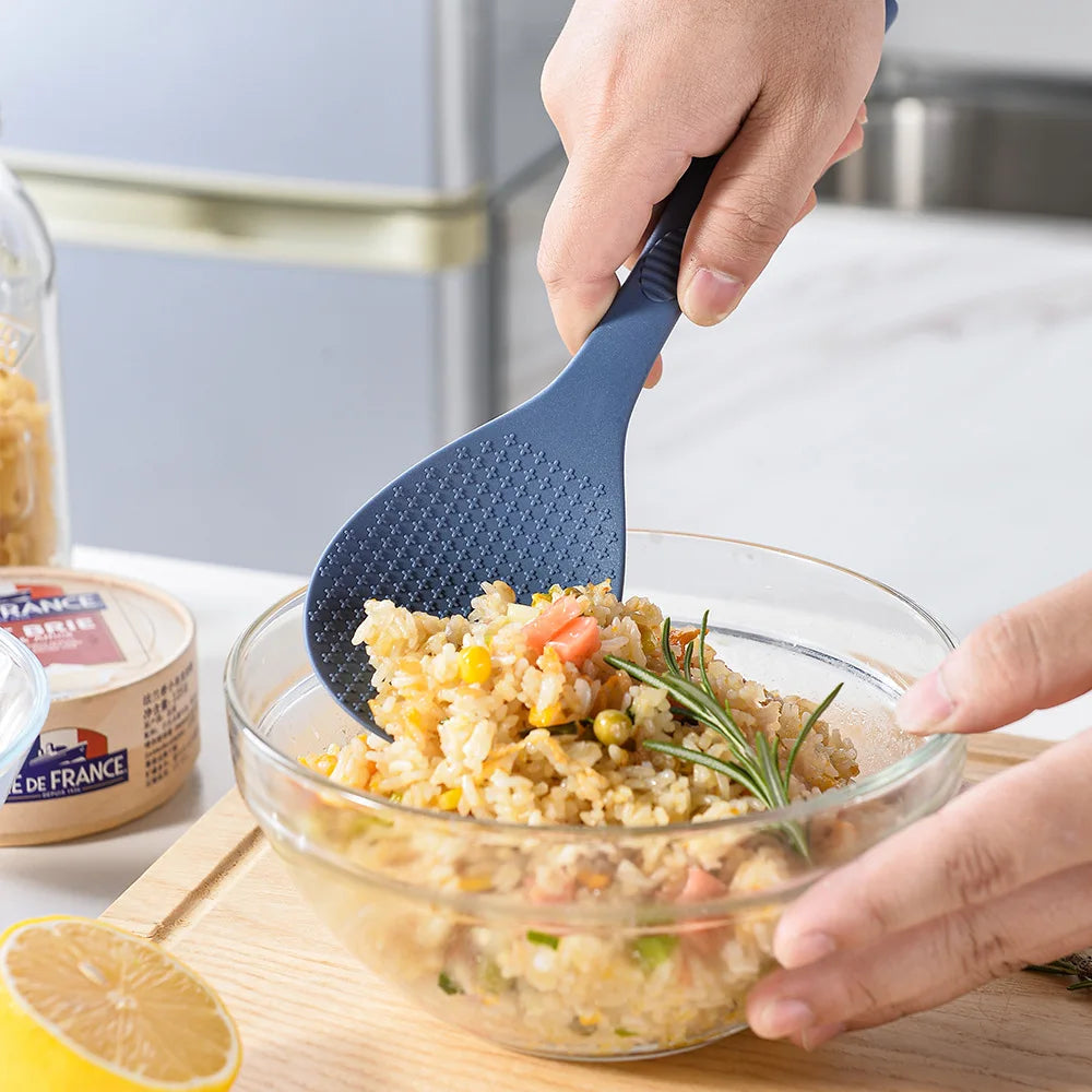 Coocosh elegant blue silicone rice spoon, expertly designed with a heat-resistant non-stick surface and ergonomic grip, effortlessly enhances your culinary experience, making meal prep and grain serving a delight from any angle.