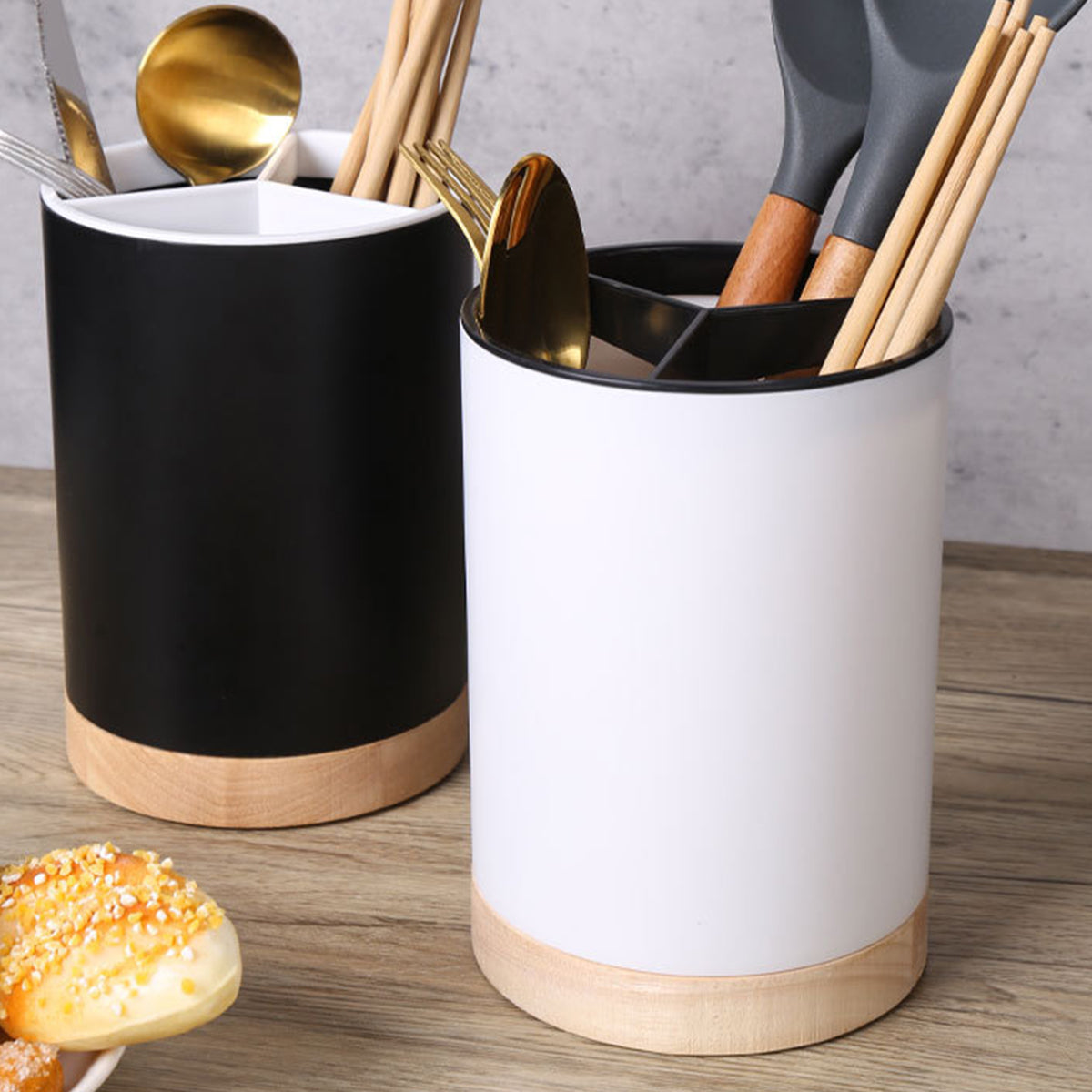 Coocosh's sophisticated black and white utensil holders embody modern elegance, featuring a detachable design for effortless organization. Stylishly showcasing wooden utensils, they elevate kitchen aesthetics while maximizing space efficiency in contemporary homes.