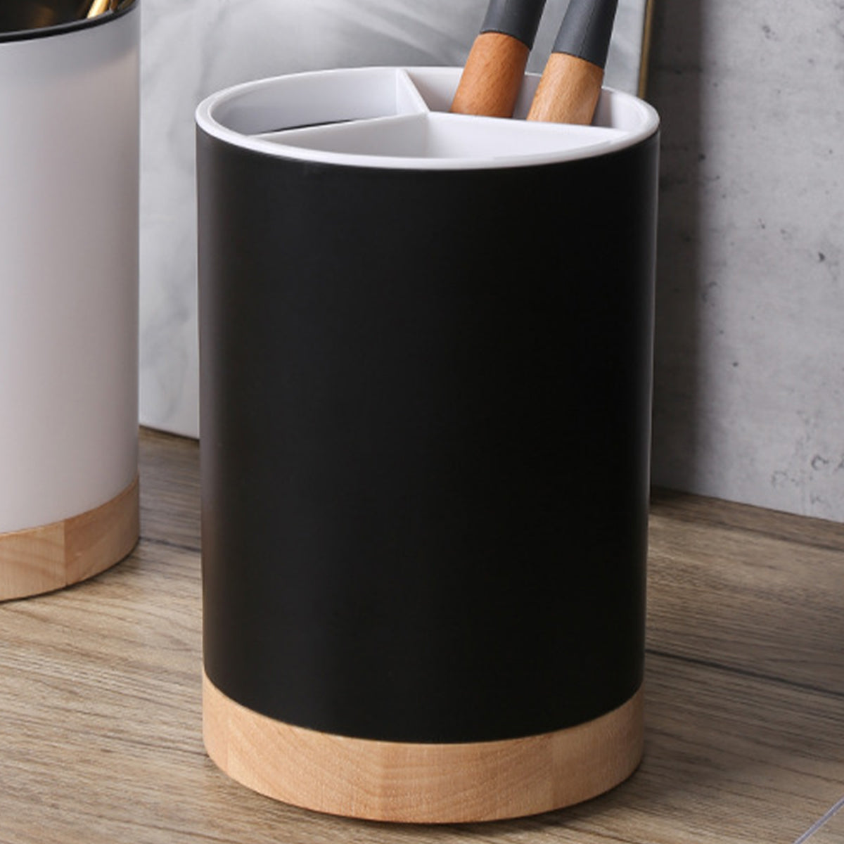 Coocosh sleek black pen holder with a bamboo base, elegantly organizing your writing instruments while enhancing modern kitchen decor. Its compact, detachable design promotes seamless storage, making it a stylish yet functional addition to any workspace.