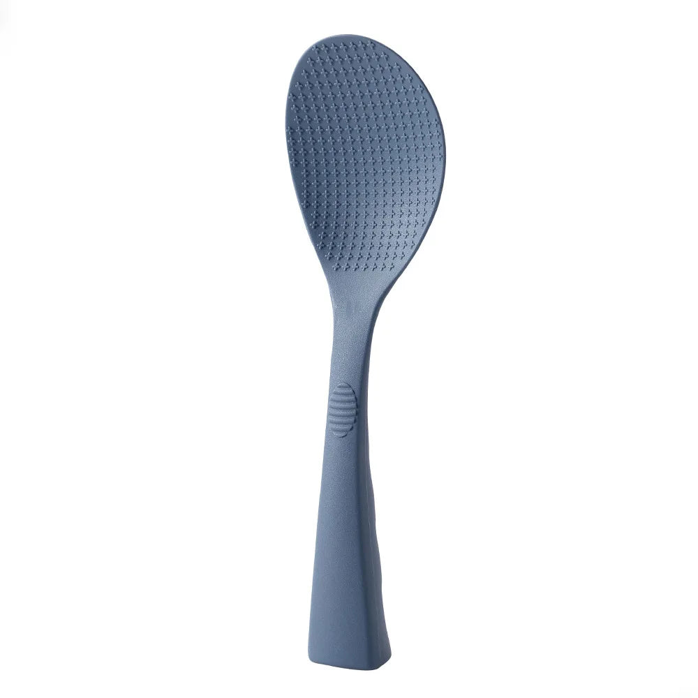 Coocosh blue silicone rice spoon, featuring a textured surface and slender handle for an ergonomic grip; ideal for effortless serving while ensuring food safety with its heat-resistant, non-stick design. Elevate your kitchen experience with elegance.