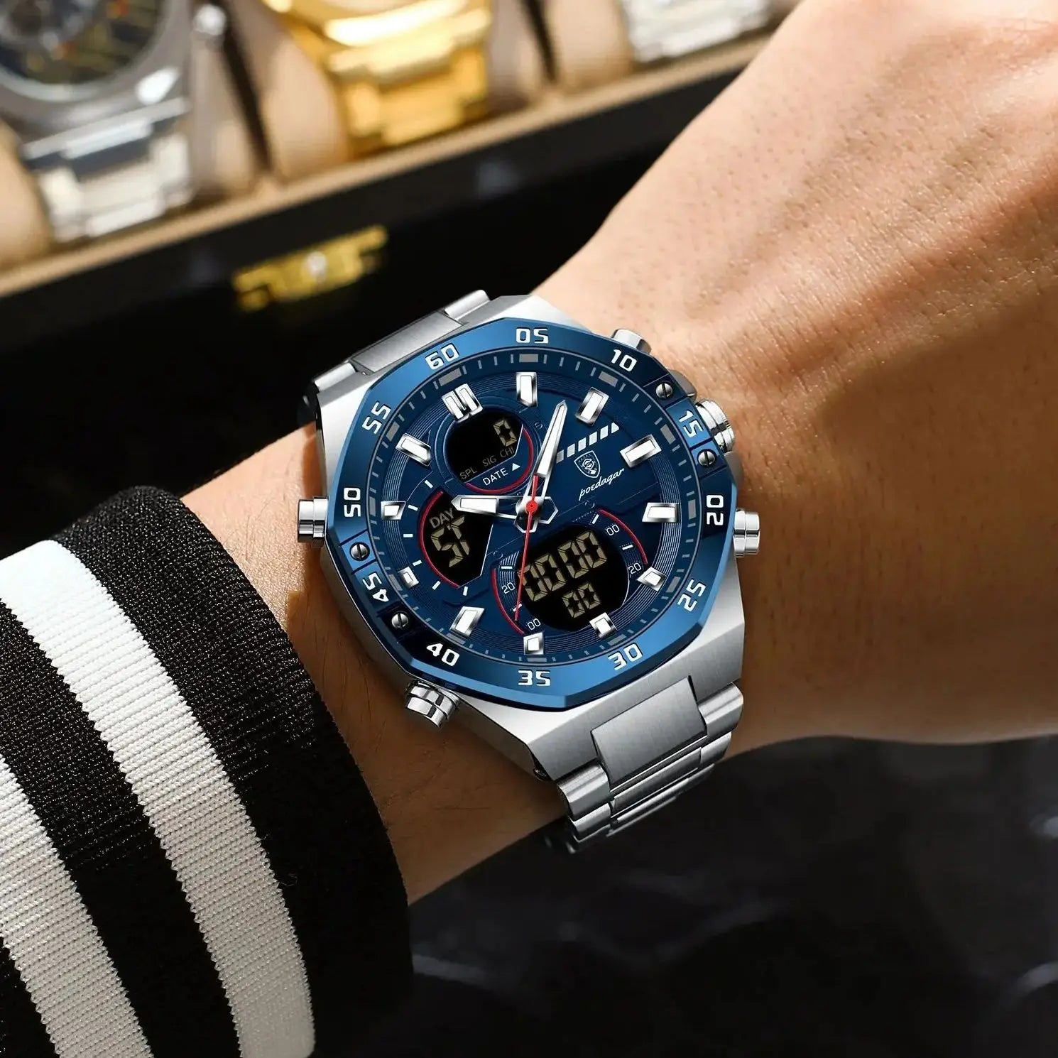Coocosh's POEDAGAR Top Man Watch features a striking blue dial and sleek stainless steel band, blending sophistication with functionality. Its luminous display and dual features ensure punctuality and style from any angle, perfect for the modern man.