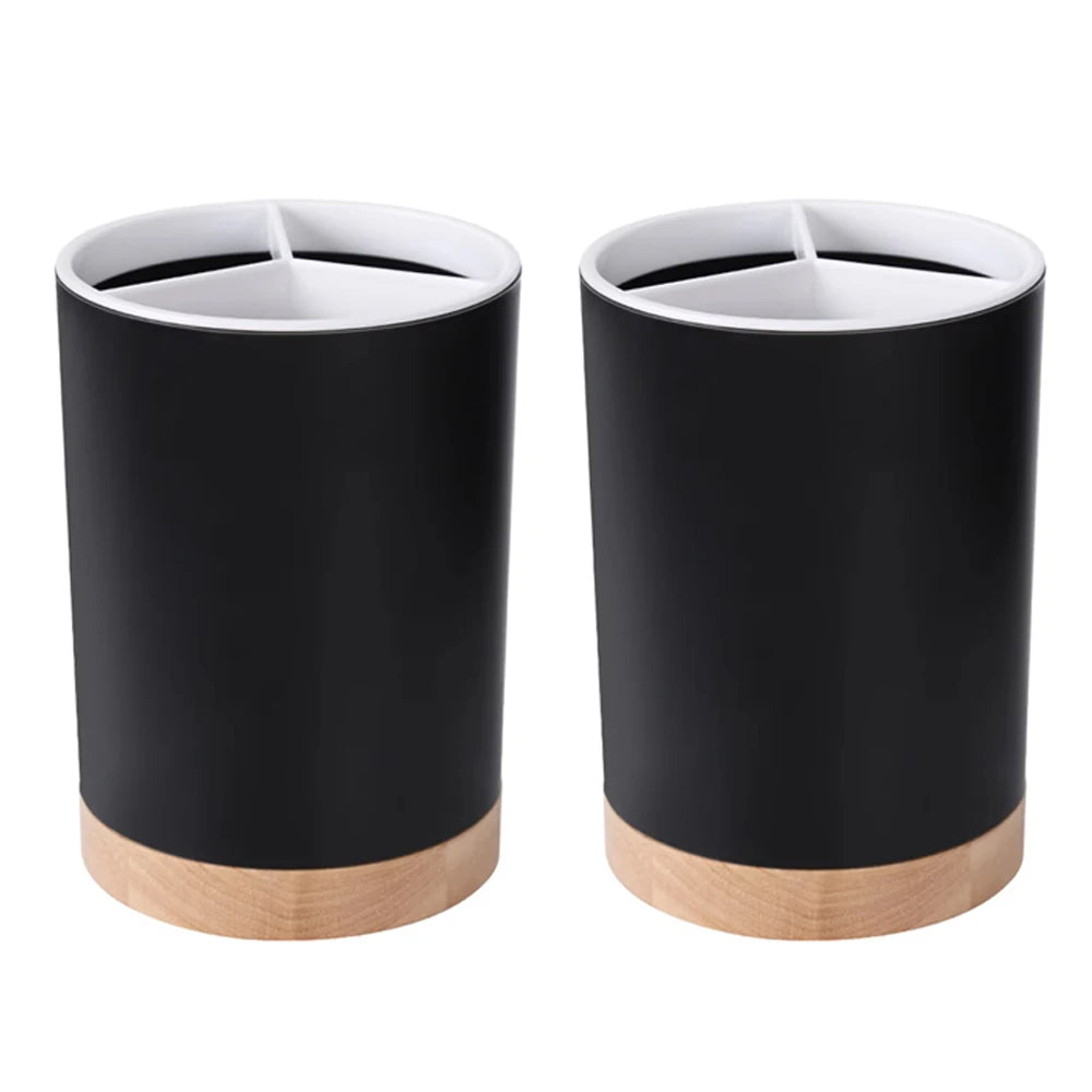 Coocosh's sleek black cylindrical containers with elegant wooden bases serve as versatile organizers, effortlessly enhancing any modern kitchen decor while ensuring moisture filtration and compact storage for a stylish, clutter-free cooking experience.