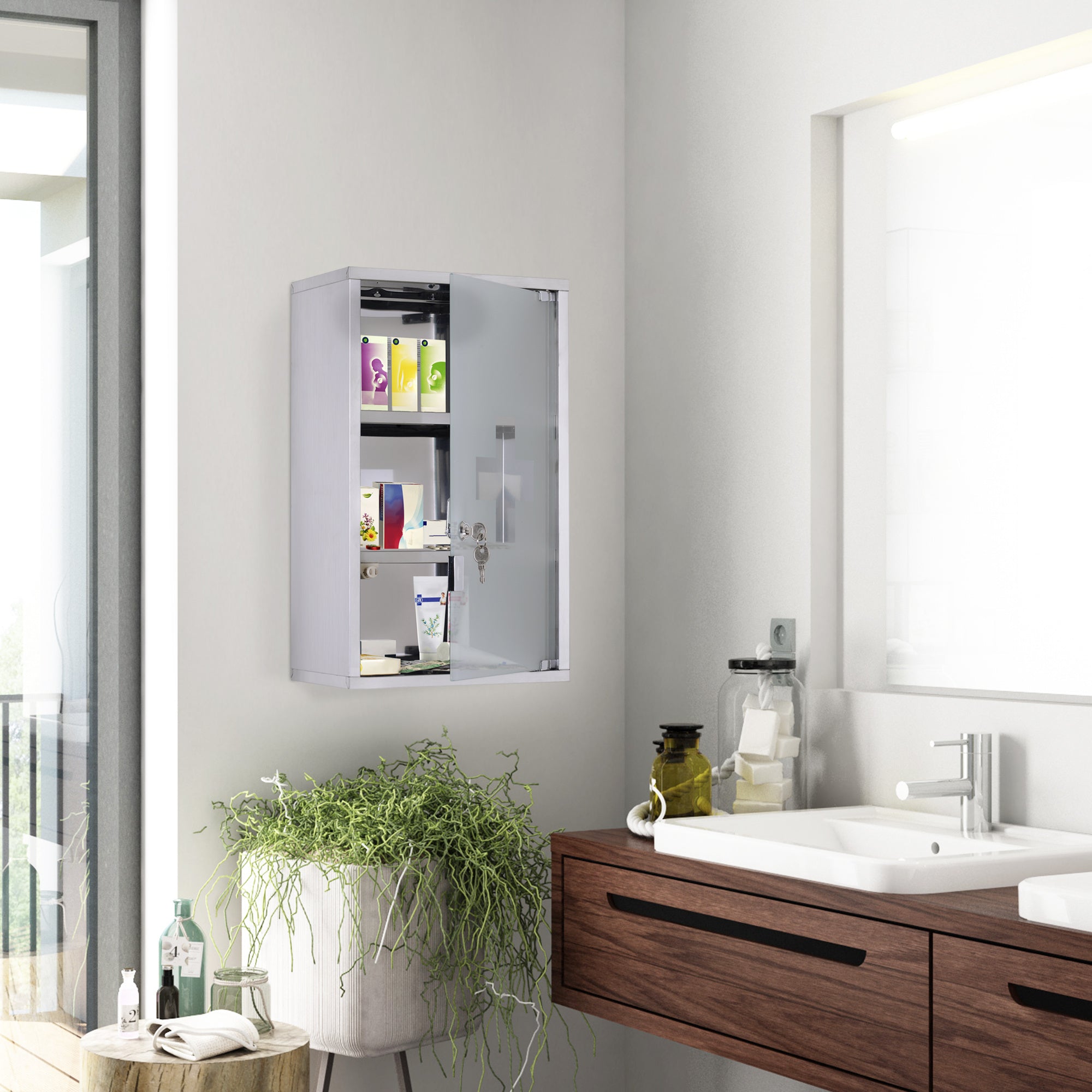 Coocosh medicine cabinet in a modern bathroom setting, featuring a clear glass door and silver frame, storing various personal care items and displaying keys for secure access, offering a clean and organized storage solution for essential health and beaut