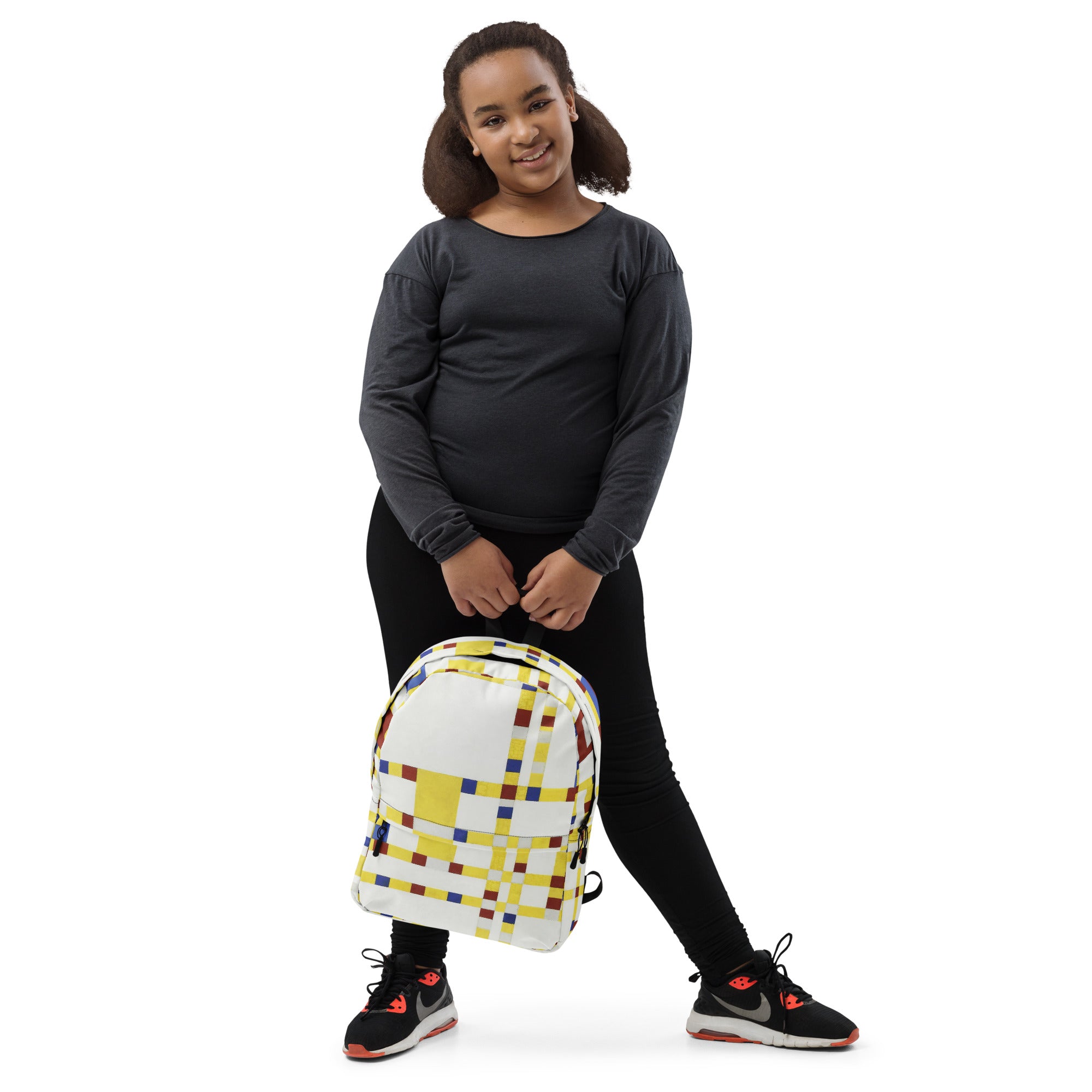 Coocosh Broadway Boogie Woogie geometric backpack, adorned in vibrant yellow and white, designed to enhance daily adventures with ergonomic straps, a laptop compartment, and water-resistant features for effortless style from any angle.