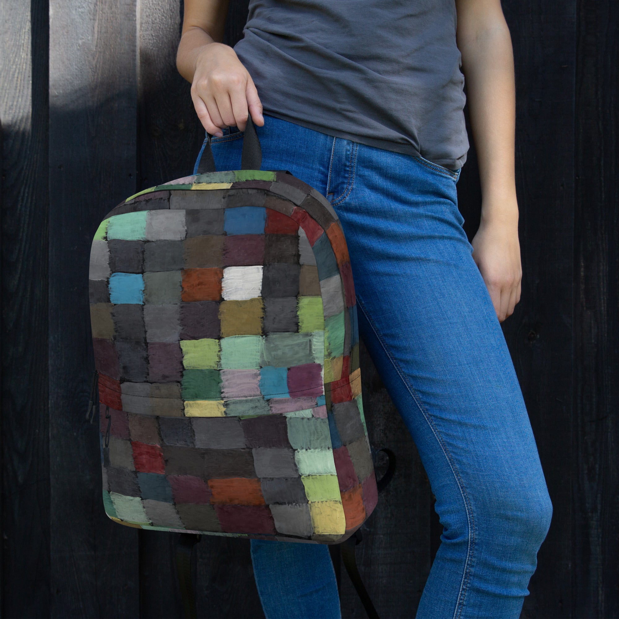 Coocosh vibrant patchwork backpack, effortlessly combining style and functionality, features durable, water-resistant polyester. Perfect for athletes or daily commuting, it comfortably fits a 15-inch laptop while making a bold statement against any backdrop.