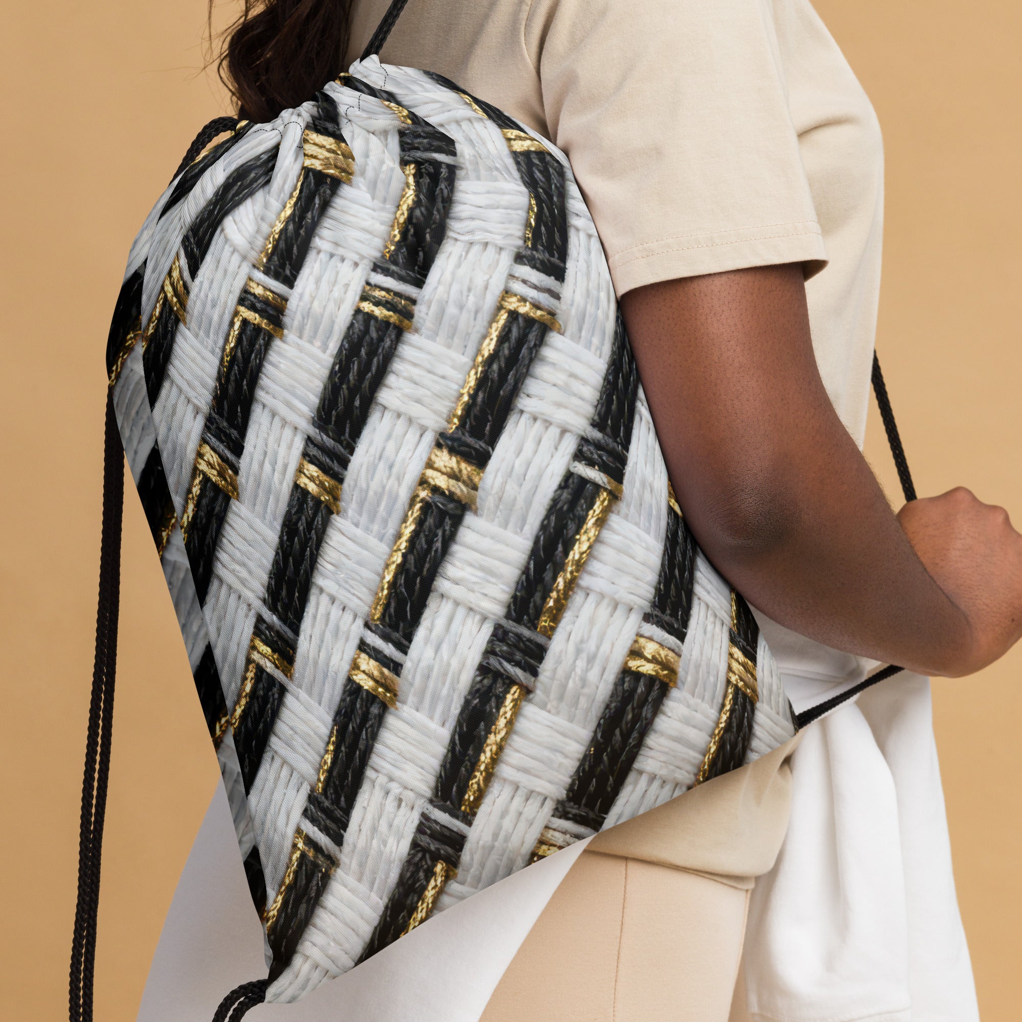 Coocosh Twill Treasure drawstring bag elegantly blends sporty chic with functionality, featuring a striking woven pattern in black, white, and gold. Perfect for everyday carry or gym essentials, it offers lightweight, portable storage for the modern lifestyle.