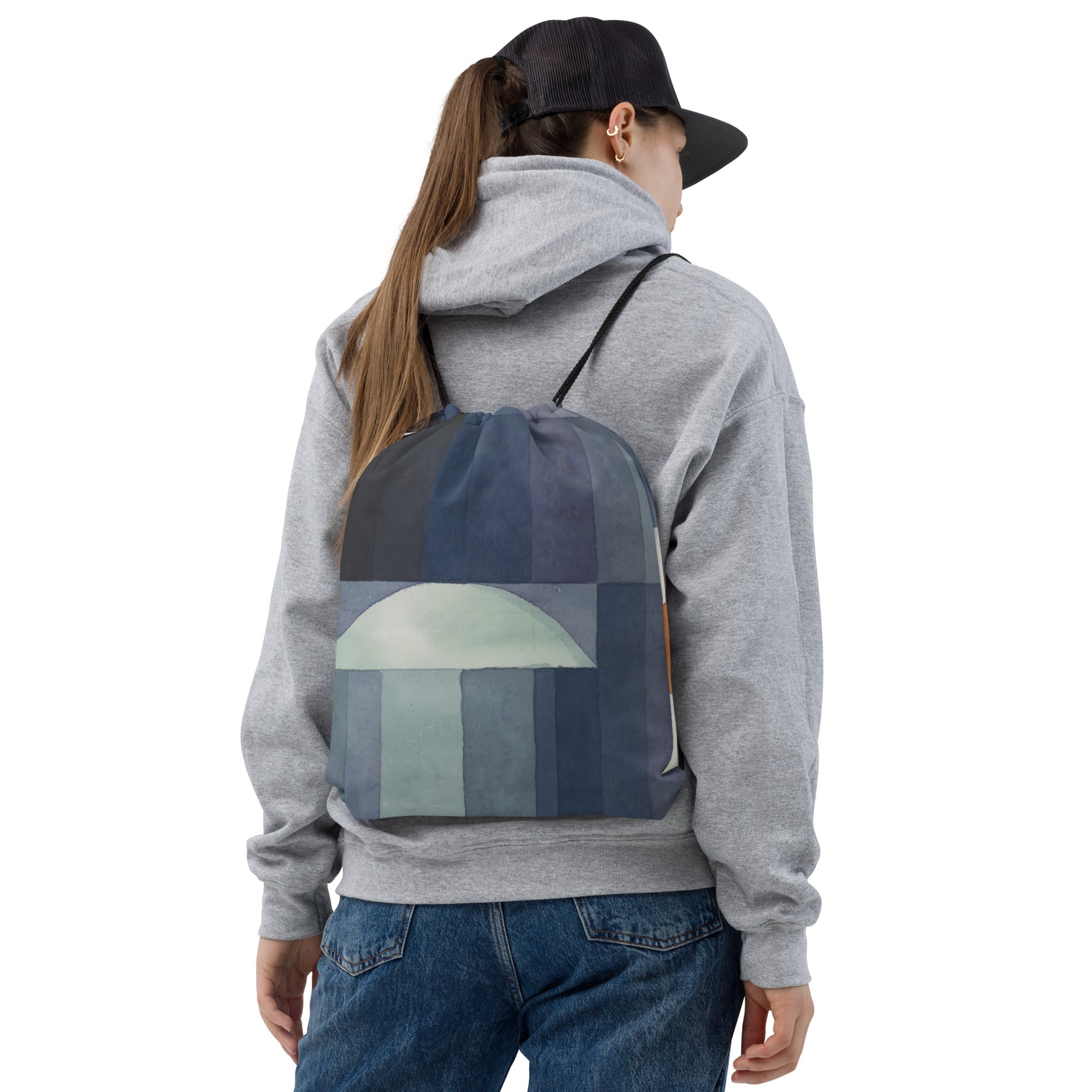 Coocosh drawstring bag adorned with an abstract geometric design in vibrant blue and green, ideal for those on the go; crafted from durable 100% polyester, seamlessly blending style and practicality for urban adventurers.