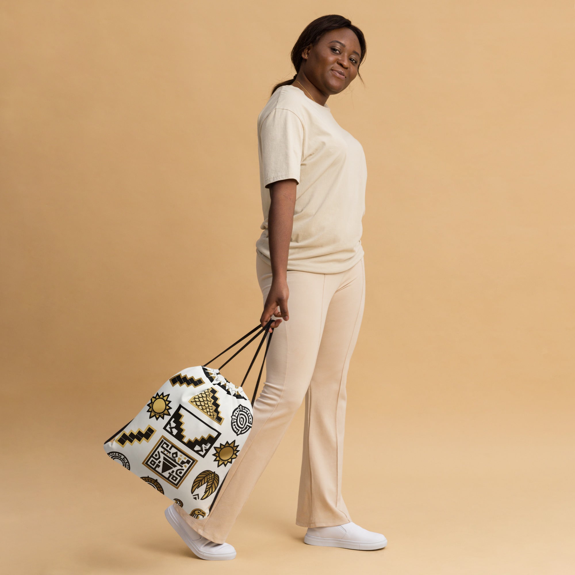 Coocosh's Glyph Theory geometric patterns drawstring bag embodies effortless style and functionality, perfect for transporting daily essentials with ease. Lightweight yet durable, it enhances casual outings or gym sessions while showcasing vibrant, artistic designs.