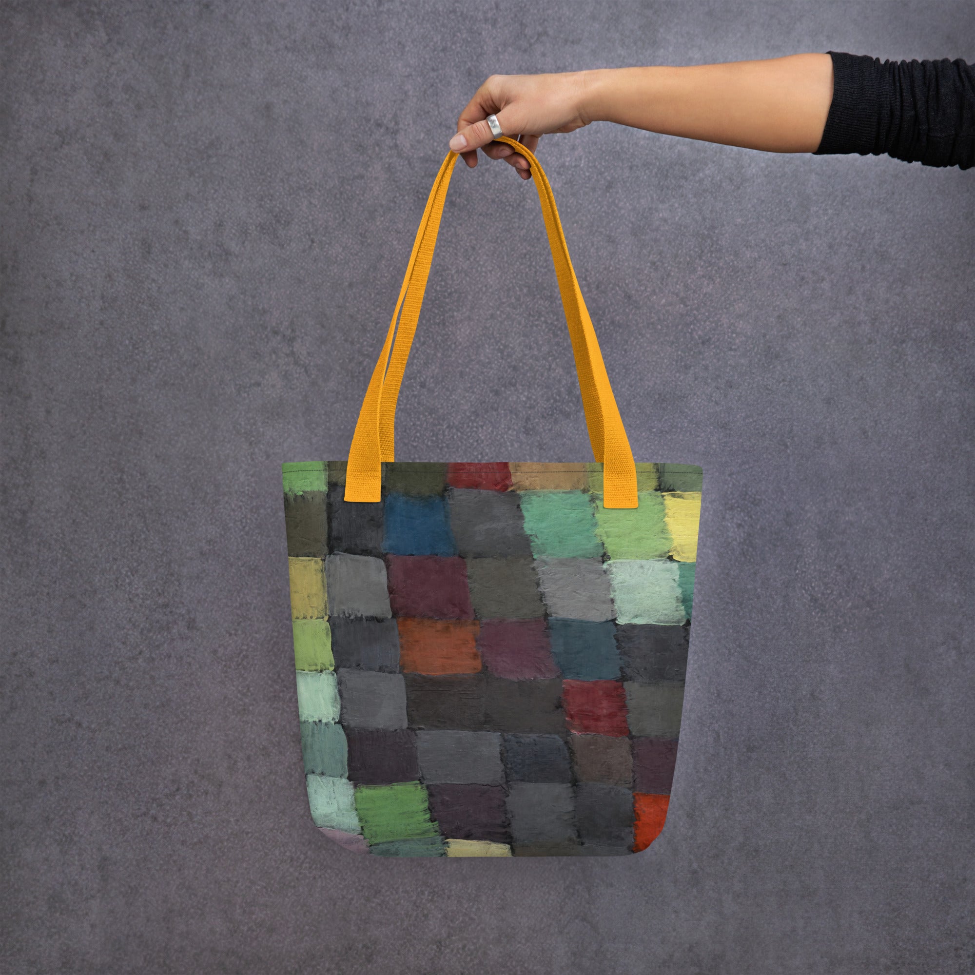 Coocosh vibrant patchwork tote bag, artistically designed with multicolored fabrics and sturdy yellow straps, perfect for everyday adventures or beach outings, combining style with functionality for a spacious and lightweight carrying solution.