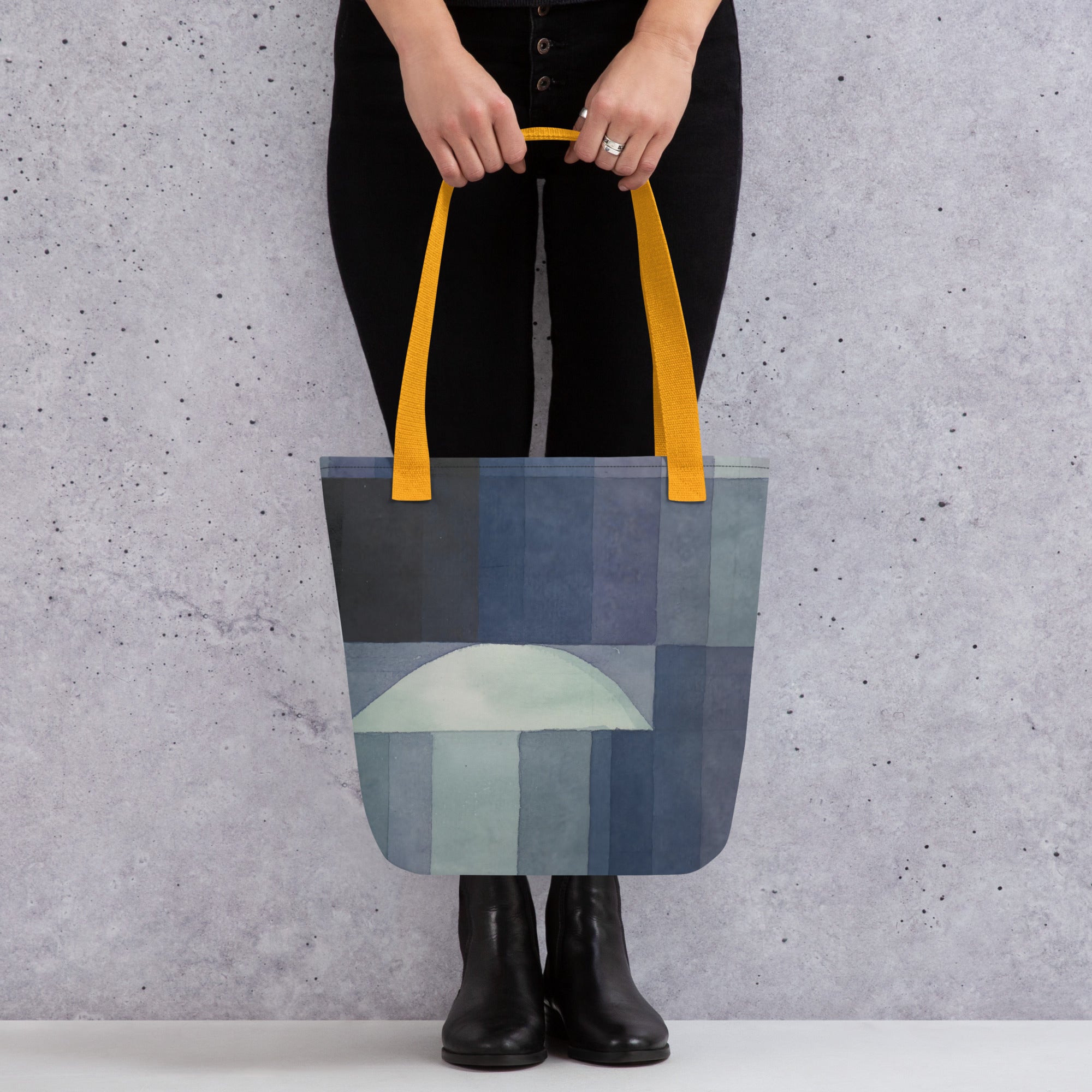 Coocosh's Der Bote des Herbstes tote bag, featuring an abstract geometric design in rich blues, complemented by sunny yellow handles. Stylish and eco-friendly, this spacious tote elevates fall fashion while offering durability for everyday adventures.